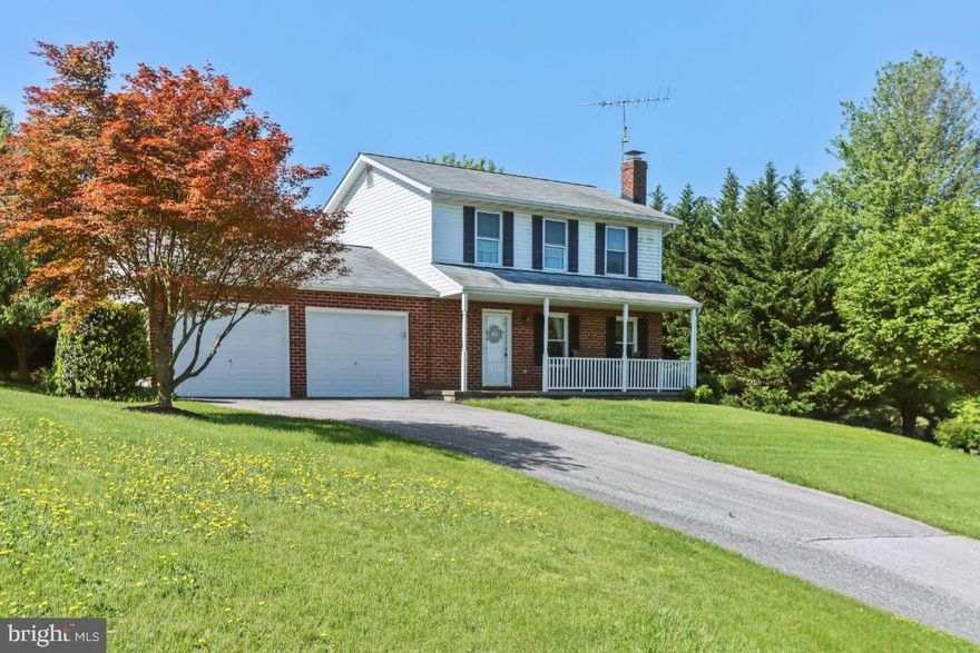 Beautiful 3 bedroom  well kept Colonial with 2 car garage.. This home is the perfect starter home with hardwood floors,  Remodeled bath, Fully finished Lower Level, Nice sized kitchen with table space.  The 1.5 acre lot is absolutely Gorgeous..Don't miss this one