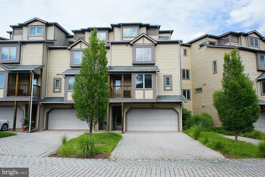 This townhome in the amenity rich Chesapeake Harbour is ready for you! This property boasts a deluxe chefs kitchen , water views, 2 gas fireplaces, granite counters, and so much more! Primary suite features gas fireplace, deck with water views, walk-in closets, luxurious bathroom equipped with oversized walk-in shower and jacuzzi tub. Community amenities to include pools, beaches, piers, kayak launch, and tennis courts! Private Marina and water front restaurant located in this gated community. NO PETS allowed per HOA.