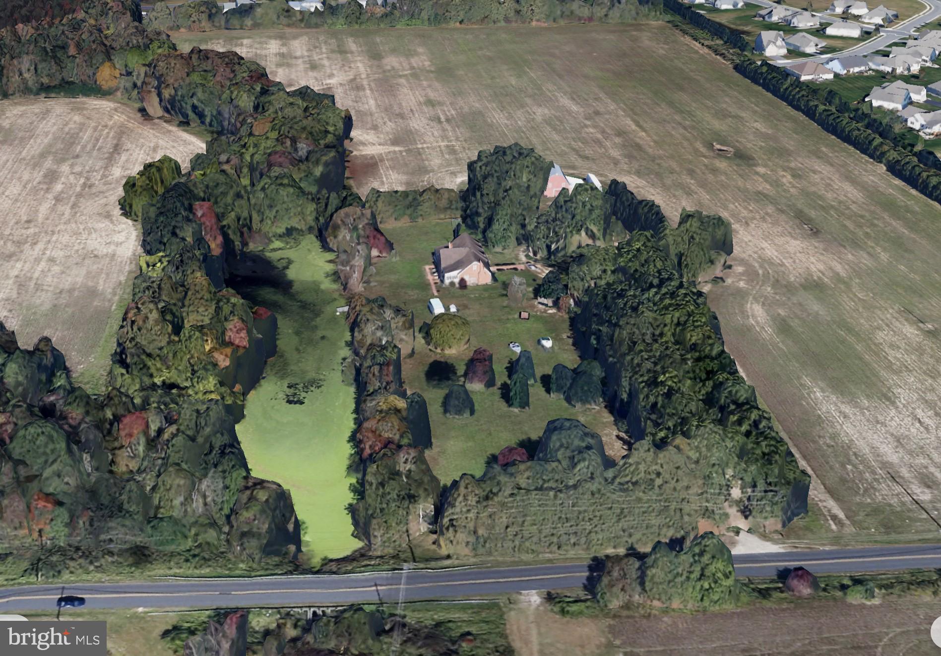 FIRST TIME EVER AVAILABLE to the Market! Situated across from the 262 Acre Pemberton Historical Park on the Wicomico River! This very special property boast approximately 8 acres, 4600+ Sq Ft Traditional Brick Home well constructed, privately owned pond, large barn and outbuildings, open space perfect for pastures! Could be a magnificant equestrian farm! Incredibly rare opportunity to own this 6 Bedroom, 3 Bathroom estate along the sought after Pemberton Drive corridor and be able to walk across the street to all the amenities and/or events offered at the Park!
Dual Enclosed 3 Season Sunrooms on the back of the house. Quality construction, freshly painted. Full basement. Original sturdy hardwood floors, Crown Molding, Chair Molding, Wainscotting. 2 fireplaces. First floor primary bedroom plus two additional. 3 more good sized bedrooms on the 2nd floor plus bonus and storage rooms. Lots of rooms in this private estate, must see this one to really appreciate it! Cost of materials to duplicate the beautiful craftsmanship in this home would be extensive . Move in ready or bring your vision and update. Oil heat, central air, well & septic. Septics were checked when land was recently subdivided and new perc tests were done as well. Long, tree lined private driveway offers privacy and quick access to Pemberton drive. 10 minutes to downtown with the feel of country living. Seller owns surrounding land currently agricultural farmland (possible uses on surrounding land include agricultural crops, solar lease, development, other). Property is befitting from Agricultural use for Taxes, so it's subject to Ag Transfer Tax if taken out of Ag use. Buyer signs affidavit at closing to keep the status. Pemberton Historic Park is a landmark location distinctive to Wicomico County. The 262 Acres features Pemberton Hall, a history home built in 1741, extensive trails, nature center, outdoor amphitheater, fresh water ponds with catch-and-release fishing, public restrooms and several picnic areas. They host environmental education programs and special events like the Wine and Beer festivals, and several others. Enjoy beautiful walking trails alongside the Wicomico River and walk back to your private farmette. 30 minutes to the beaches of Ocean City, just 10 minutes to Tidal Heath Hospital and Salisbury University. Close to Rt. 50 for easy access to Balitmore / Washington Metro areas located approx. 2 hours away. This unique property offers a well preserved rustic lanscape nestled among many well loved residential communities so you enjoy the best of both worlds and a very convenient location for everything else you need! You get to get away with out getting too far away! Seller's also have listed for sale the almost adjacent home on 6 acres with 1760 sq ft 3 BR 1.5 BA home, wtih cool brick outbuilding, listed under MLS#MDWC2015092 $450,000.