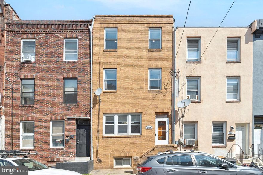 Unlock the potential at 519 Dickinson Street, a hidden gem nestled in the vibrant heart of South Philadelphia! Where the possibilities are as endless as your imagination. This three-story features 4 bedrooms with potential for a 5th, 2.5 bathrooms, and over 1,650 square feet of living space just waiting for your personal touch. The main floor invites you with a roomy living and dining area perfect for gatherings or cozy nights in. The spacious kitchen leads to a quaint backyard, just waiting to become your private urban oasis or social hot spot. Venture upstairs to discover 3 sun-drenched bedrooms and a full bath. For those with lofty ambitions, there's rooftop access primed for transformation into a stunning deck with skyline views. The top floor features a grand 4th bedroom that could easily become two separate rooms, along with a convenient powder room. Located in the charming Dickinson Narrows, you'll enjoy proximity to the energetic Passyunk Square and the conveniences of Center City. This home is your blank slate, ready to be shaped and styled to your heart's desire.  Sold in as-is condition—bring your dreams and make them a reality!