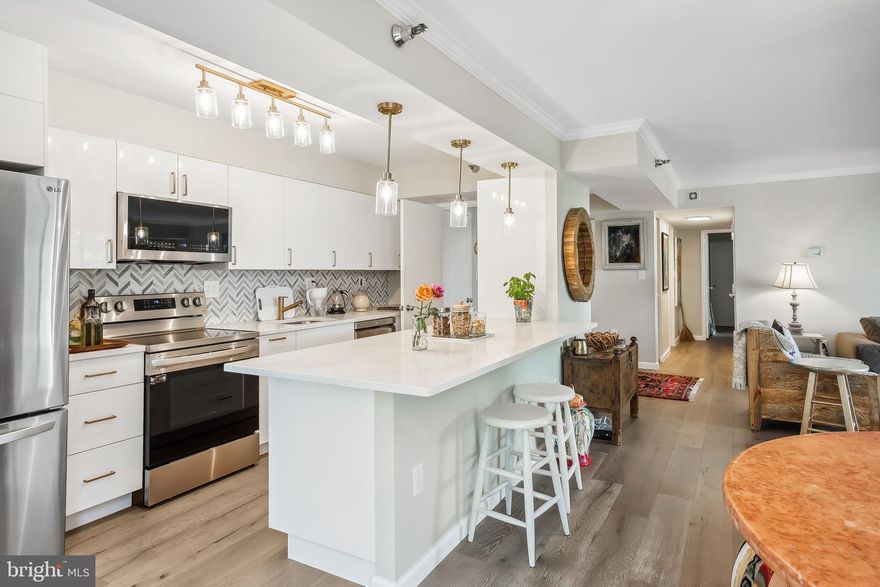 Welcome to this Modern Luxury Condo at The Encore of McLean! This 2-bedroom, 2-bathroom condo features a bright and spacious floor plan. As a corner unit on the 9th floor, it offers stunning views and an abundance of windows that fill the space with natural light. This beautifully renovated condo boasts new hardwood floors, fresh paint, and a fully renovated kitchen with new countertops, modern cabinets, backsplash, and brand-new appliances. The oversized balcony, overlooks  two sides of the building, overlooks treetops and the cityscape. Bright and inviting, the condo includes in-unit laundry, two enclosed garage spots, and extra storage. Located less than a mile from Tysons Corner Center and just steps to the metro, Wegmans, Capitol One Hall, and more, it offers unmatched convenience.
Enjoy community amenities such as pools, a fitness center with sauna, library, social rooms, 24-hour security, and concierge services. Live, work, and play in the vibrant heart of Tysons Corner—your dream home awaits!
Schedule your tour today!