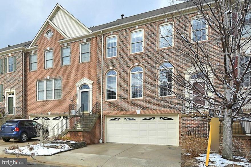 BRICK FRONT with 2 Car Garage in the Heart of Fairfax. HW Floors throughout the main level. Kitchen with new GRANITE COUNTERS, large CENTER ISLAND w/ BREAKFAST BAR. Family Room opens to DECK w/ stairs to beautiful BRICK PATIO. Open LIVING/DINING room w/ 3-sided glass FIREPLACE. VAULTED CEILINGS in Master Bedroom & Bath w/ separate Shower & Soaking Tub. FULLY FINISHED WALKOUT LL w/ FULL BATH.