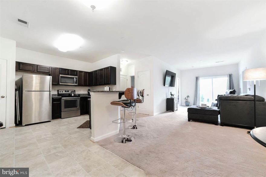 This spacious Condo at the Residences at Wildewood community - offer maintenance-free living!  No shoveling snow this winter!  This 2 bedroom, 2 bath condo offers a large Living Room opening onto a balcony overlooking trees and is very private.  The primary bedroom is spacious with a large walk-in closet and  bath. The second bedroom also has an attached bath. The washer & dryer convey in the separate laundry area.  The dining area is just off the spacious kitchen. With plenty of cabinets, granite countertops and new appliances (this condo was new in 2018), you will love the openness of this home.  A single- car garage (#10 with opener) comes with this home, as does an additional storage space (#11).  Condo fee includes water, sewer, trash, lawn maintenance, and snow removal, as well as use of a clubhouse, fitness center, tot lot and free guest parking.  Within walking distance of Harris Teeter, and restaurants, and minutes to Pax River NAS,  Solomons, and commuting routes.  These condos are in high demand!