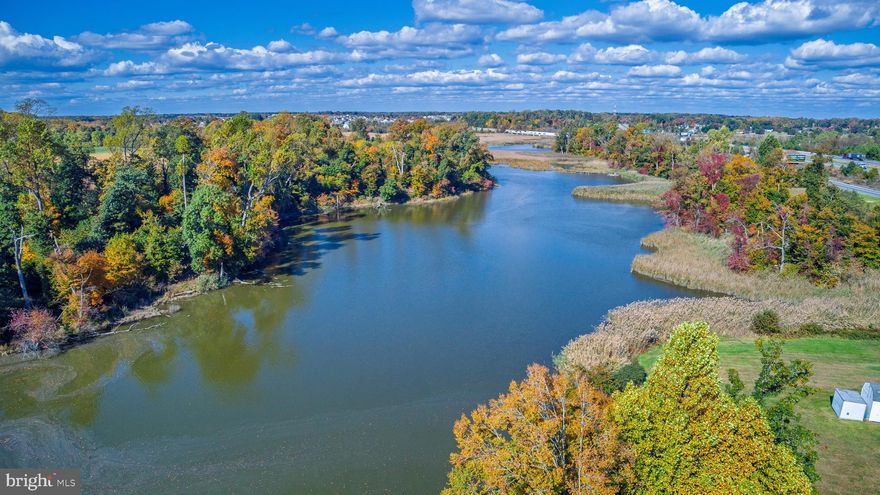 Nestled along the peaceful banks of the Appoquininmink River, this remarkable 2.6-acre waterfront lot offers a rare opportunity to experience both privacy and natural beauty. The property offers a large, level parcel of cleared land, providing an excellent opportunity for constructing a residence. At the rear of the property, breathtaking water views create a picturesque setting perfect for those who cherish quiet escapes and wildlife observation, with kayaking and fishing opportunities available directly from your own backyard. This waterfront lot provides unparalleled freedom and flexibility for homeowners. With no builder tie-in, no homeowner’s association (HOA), and very limited restrictions, you are empowered to design and construct a home that truly reflects your vision. It is important to note that the property will require the installation of a private well and septic system. Prospective buyers are encouraged to conduct thorough due diligence to ensure their plans for the property can be successfully realized.