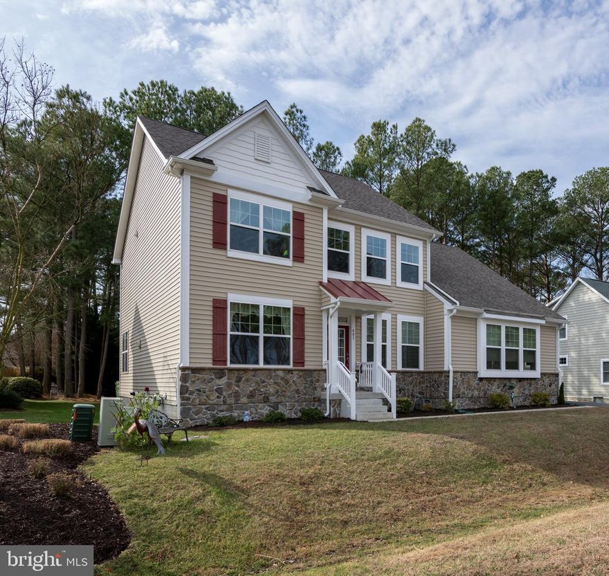 Welcome to The Pointe, one of Ocean Pines most sought after areas! 403 Bluewater Court is the perfect location for low traffic and peaceful living. When you first walk in, you will be greeted by a ton of natural light with the soaring ceilings and wall of windows. There is also a first level primary bedroom with a walk in closet and gorgeous bathroom. The living area boasts an open concept that connects the kitchen and living room. Perfect for lighting the fireplace and entertaining guests. The Ocean Pines community has a ton of amenities including 5 pools, racquet center, golf course, farmers market and beach club just 8 minutes away in Ocean City. Some of the home features include original owners and recently being built in 2022, deck with access from the bedroom to enjoy morning coffee, backyard, beautiful open kitchen with granite counter tops, stainless steel appliances with a ten year warranty (7 years left) and a huge walk in pantry, first floor primary suite, 9' ceilings, 2 car attached garage, tankless hot water heater, 18x12 unfinished bonus room, den ( currently being used a wine room ), cement floored crawl space that is 4' tall with inside access for additional storage, hardwood flooring, tile shower and floor, loft area and upstairs bedrooms. There is also an approval for a front patio. The Pointe has street lights and is the place for a nighttime walk on the warm summer nights! The new chapter for 2026 starts here and after all.....You Deserve It!