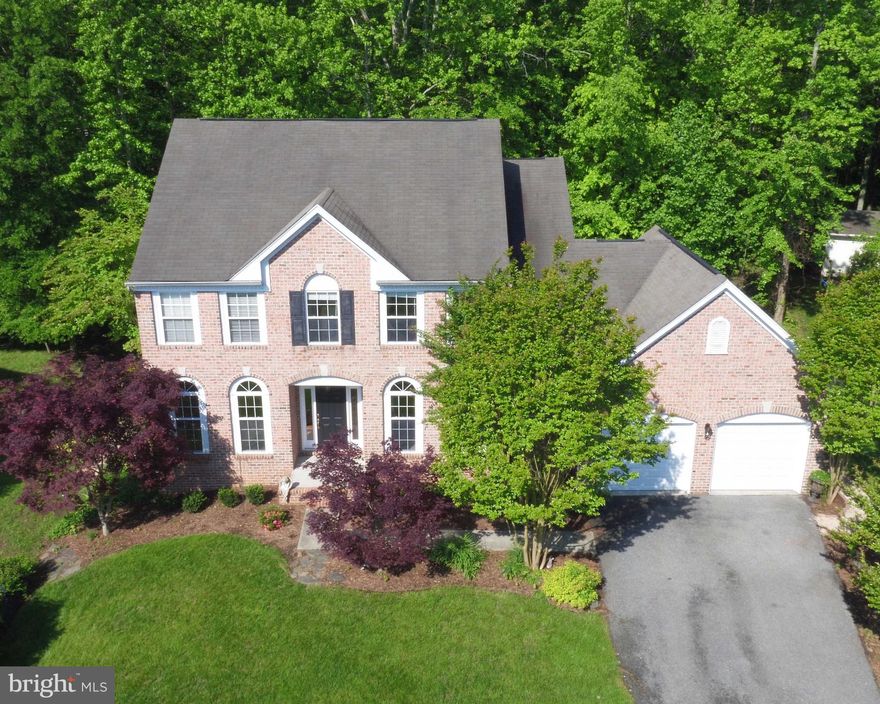 SOUGHT AFTER MISTY RIDGE--BEAUTIFUL BRICK FRONT HOME W/RECENT PAINT AND CARPET--HARDWOOD ON THE MAIN LEVEL--OPEN FLOORPLAN W/2STORY FOYER--9' CEILINGS--GAS FIREPLACE--PRIVATE DECK BACKING TO WOODS--LOTS OF CURB APPEAL--FULL UNFINISHED BASEMENT AWAITING YOUR DESIGN--DRIVEWAY ALLOWS FOR AMPLE PARKING--PRICE ADJUSTMENT--GREAT NEIGHBORHOOD W/LOTS OF MARINAS NEARBY--MAYO SCHOOL WITHIN WALKING DISTANCE!