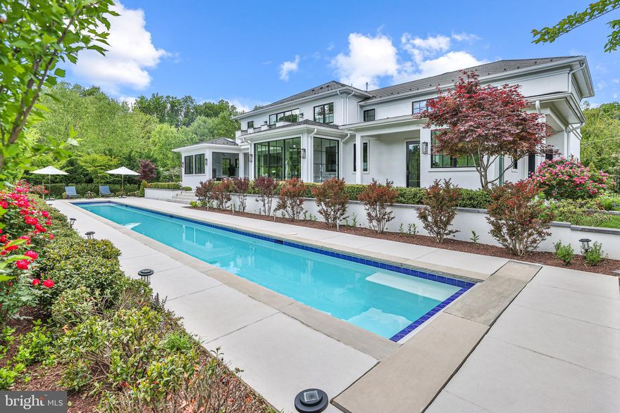 Perfectly situated in prestigious McLean, Virginia just minutes to Washington, DC, this timeless estate residence reflects a modern interpretation of classical architecture with unwavering attention to detail. The residence reflects elements of design inspired by the owner's own European background and captures features and elements generally reserved for larger custom estates.  This is immediately evident upon entering the discrete driveway and parking court which is finished with Italian granite pavers.  The quality of the timeless exterior is further evident in the use of the highest grade of concrete stucco, stone and Western Windsor Windows.

Stepping inside the custom double entry doors, guests are welcomed into an expansive reception hall.  On either side of the entry, a comfortable study and a dining room flank the entry which then continues to the open concept kitchen, breakfast room and living room.  Drenched in natural sunlight and with views to the stunning garden, the chef’s kitchen includes every possible amenity including custom European style cabinetry, professional appliances, an oversized refrigerator/freezer, gourmet gas range, steam oven, convection oven, warming drawer, and a wine cooler.  The expansive space is further enveloped in a dramatic wall of glass which opens to the heated lap pool and richly planted garden beyond.  An elegant terrace leads to a three seasons garden room with a fireplace overlooking the pool.   

Upstairs, a custom staircase introduces a large media room, the primary bedroom suite, and two additional bedrooms, two with en-suite baths. The primary suite is a quiet oasis overlooking the pool and gardens below.  The primary bath is finished in marble and timeless European fixtures, including a sumptuous soaking tub, steam shower and heated floors.  The elegant dressing room is finished with European cabinets and includes a separate washer/dryer.
The generous lower level boasts a home gym, a recreation room, and a bonus room which is perfect for a future home theater and wet bar.  An elevator services all three levels of the residence, and an oversized, three car garage provides ample parking, extra storage space, and expansion possibilities for extra living space upstairs. 

Just 14 minutes to Washington, DC and less than 5 minutes to downtown McLean, this timeless estate residence is ideally located in the region's most prestigious location. This gracious home is the perfect blend of sophisticated country living within easy reach of  the area's urban offerings.  Rarely does a residence of this quality, design and location become available at this price point, making this one of the attractive current offerings in the Washington region.