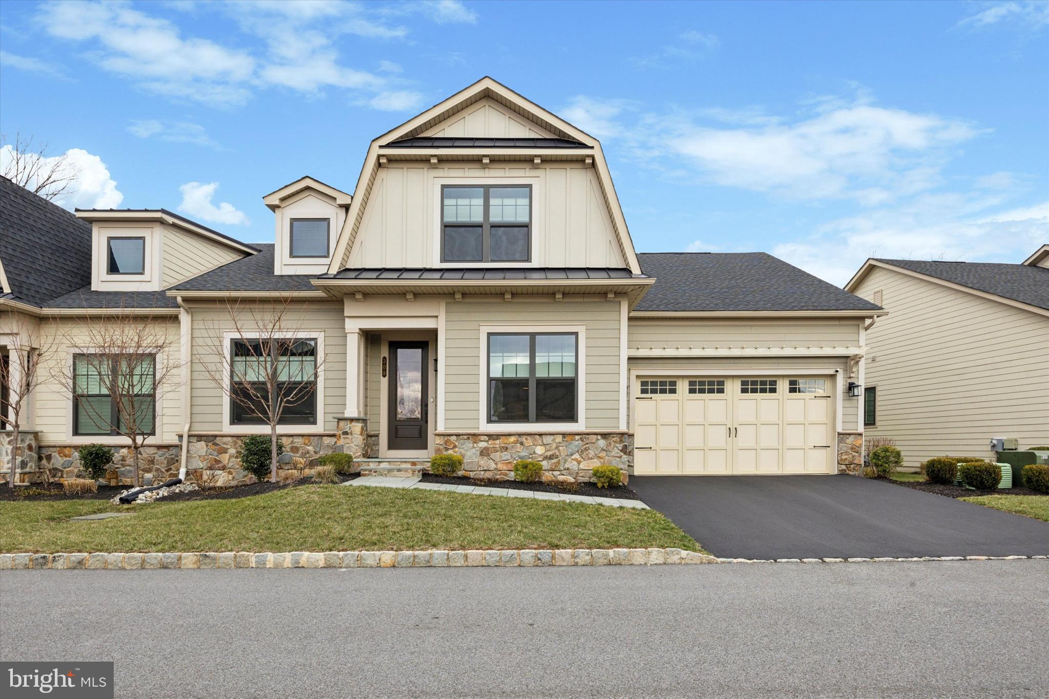 Welcome to 309 Ap Even Road. This gorgeous carriage home is located on a cul-de-sac street in the desirable Wayne Glen community recently completed by NVHomes. This home offers over 4,000 square feet of luxurious living space spread across three open levels, four bedrooms, four full bathrooms, a finished basement, a whole house generator, a two-car front entry garage with epoxy floors and 240/40 amp outlet for electric car chargers, upgrades galore, and tasteful finishes throughout. The exterior consists of maintenance free Hardie Plank siding, thin cut real stone veneer, standing seam metal accent roofs, an attractive color palate, flagstone walkway, and a carriage style garage door with decorative hardware. The first floor includes: dining room off the foyer; living room with vaulted ceiling and gas fireplace; laundry room off garage; a guest bedroom currently configured as an office, a full hall bathroom, and an office with double 15 lite glass doors and transom window. The centerpiece is the magnificent gourmet kitchen with attractive cabinetry, stainless steel appliances, quartz countertop, center island with farm sink, dishwasher, pendant lighting, and overhang seating for four, subway tile backsplash, and a pantry featuring a professionally installed organization system with 6-tier lazy Susan. An adjacent breakfast room has matching cabinetry, countertops, and backsplash. A cased opening leads to a sun room with vaulted ceiling, an option not included in many homes, providing additional finished space in the basement and first floor. A double French patio door leads to a composite deck with natural gas hookups for a grill and a fire pit, and a privacy wall. There’s also a first-floor primary bedroom suite consisting of sleeping area with tray ceiling, walk-in closet with professionally installed custom organization system, and an upgraded bathroom with two vanities and a make-up desk, a private water closet, and a cavernous corner shower with floor to ceiling tile, dual shower heads, and frameless glass enclosure. The second floor has a bedroom with two closets, full hall bathroom with tub and tile surround to ceiling, a loft area with closets, and another finished room that could be used as an office, bedroom, or storage. The finished lower level is massive and currently has a golf simulator/theatre room with platform seating, recreation room, bedroom with walk-in closet, full bathroom, mechanical room, and plenty of unfinished space for storage. Other interior features include wide plank engineered hardwood floors throughout the 1st floor, abundant recessed lighting throughout, neutral paint, and multiple custom light fixtures. This amazing home is conveniently located close to all major commuter routes, shopping, dining, the KOP Town Center, Lifetime Fitness, the Chester Valley Trail, and is part of the top rated Tredyffrin-Easttown School District.