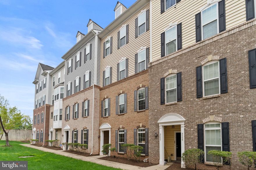 Welcome home to Lee Square! This brick townhome-style condo is gorgeous, with a light-filled, open floorplan and sophisticated primary bedroom suite. Step inside and discover a cozy living room with a sleek fireplace and floor-to-ceiling windows filling the home with natural light. Sleek plank flooring leads you into the beautiful kitchen, boasting rich wooden cabinets, upgraded countertops and a classic tile backsplash. With the breakfast bar opening into the dining area, this home is great for entertaining friends and family. Upstairs, the primary bedroom suite has been beautifully updated to include wall-to-wall built-in bookshelves and two large walk-in closets, with one boasting an enviable custom closet system. The en suite bathroom features a wide double sink vanity and a handsome step-in shower with built-in seat. Both additional bedrooms include ceiling fans and large closets, with shared access to the second full bathroom in the hallway. On the rear of the home, the one-car garage and driveway provide you with plenty of space for convenient storage and parking. This fantastic location is only half a mile to Old Town Manassas to enjoy live music at First Fridays as you explore downtown! Just minutes to Giant, Harris Teeter, Walmart, Manassas Mall, Bull Run Regional Park, Manassas Park Community Center, Prince William County Fairgrounds, and Manassas Regional Airport. Quick access to Route 28, I-66, Route 29, Liberia Avenue, and the Prince William Parkway allows for ease of travel around Northern Virginia. Schedule a private tour of your beautiful new home today!