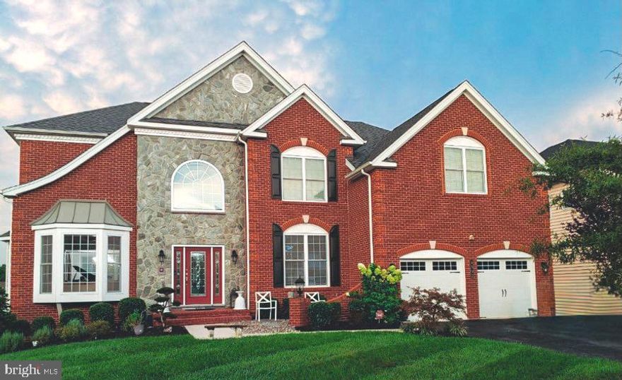 This move-in-ready sophisticated home is nestled in the bucolic surroundings of Marlboro Ridge, a Toll
Brothers premier equestrian-centric community in Upper Marlboro, MD, just 20 miles from Washington,
DC and minutes from the Capital Beltway, major commuter routes, nearby shopping, fine dining, cultural
events, and countless leisure and recreational activities.

The exterior’s visually striking architecture showcases a rustic brick and gray stone facade with custom
Panama entry door and impeccable masonry, enhanced by meticulous landscaping, vibrant floras,
hardscapes  and artistic  illumination for alluring curb appeal.

Elegance abounds as you enter the radiant 2-story foyer with marble flooring, brilliant crystal lighting and one of two grand staircases with ornate railings and balusters. The main and upper levels feature structuralmodifications— expanding capacity and reimagined spaces. The cohesion of warm hardwood flooring, picturesque window stylings, and abundance of natural light provide atmospheric balance.  Artisan luxury is prominent throughout, integrating bespoke crown and panel molding, recessed ceilings,
statement lighting fixtures, and tailored built-ins that pair ideally with functionality.

A chef-caliber kitchen is the heart of this home. An achromatic pallet compliments the natural beauty of
polished granite countertops, backsplash, stainless steel Energy Star appliances, and pristine cabinetry.
The semi-open concept includes an oversized galley island with ample seating, deep walk-in pantry, and
butler’s pantry.  Gatherings flow seamlessly to a sizable breakfast space and the enviable dual-level
family room with exterior window wall, stone veneer accented fireplace, plush carpeting and rear
ascending staircase. The formal living and dining rooms, chic powder room, and private study complete
the main level, along with convenient access to a super-sized 3-car garage and expansive 25 ft.  low
maintenance wrap around deck. 

Cozy ambience permeates the desirable split-wing layout on the upper-level, boasting (2) generously
spaced bedrooms with connecting Jack-and-Jill designer bath, and charming ensuite bedroom. Paneled
french doors create privacy and entry to the posh primary suite; a tranquil sanctuary with boutique
sitting room, massive walk-in closet designed to accommodate a built-in dry bar, wardrobe system, and
dressing area.  Relax in the coveted spa-influenced bath appointed with opulent marble surfaces and
countertops, a grand rainfall shower, luxe soaking tub, mood lighting and linear fireplace.

The lower-level overflows with room to entertain, retreat, and envision possibilities. Finished areas
include a bedroom, bath, and flexible spaces for recreation. Scalable hosting or private leisure is
convenient with a 10 seat state-of-the-art theatre room, fully customized wet bar, and linear fireplace.
Surplus space provides ample storage. Connect to a great outdoor experience with walk-out access to
14,580 square feet of fenced property. This premium backyard is perfectly suited for a pool or outdoor
entertainment oasis, extending use of the 22 ft. paver patio, 8t. circular patio, and stairs leading to the
upper deck. Electrical wiring support exists near rear landscaping of the property.

Teeming with resort-style amenities, this tranquil neighborhood oﬀers state-of-the-art equestrian
facilities, walking trails, clubhouse, pool, courts and pocket parks surrounded by more than 250 acres of
natural beauty. Call it home today!