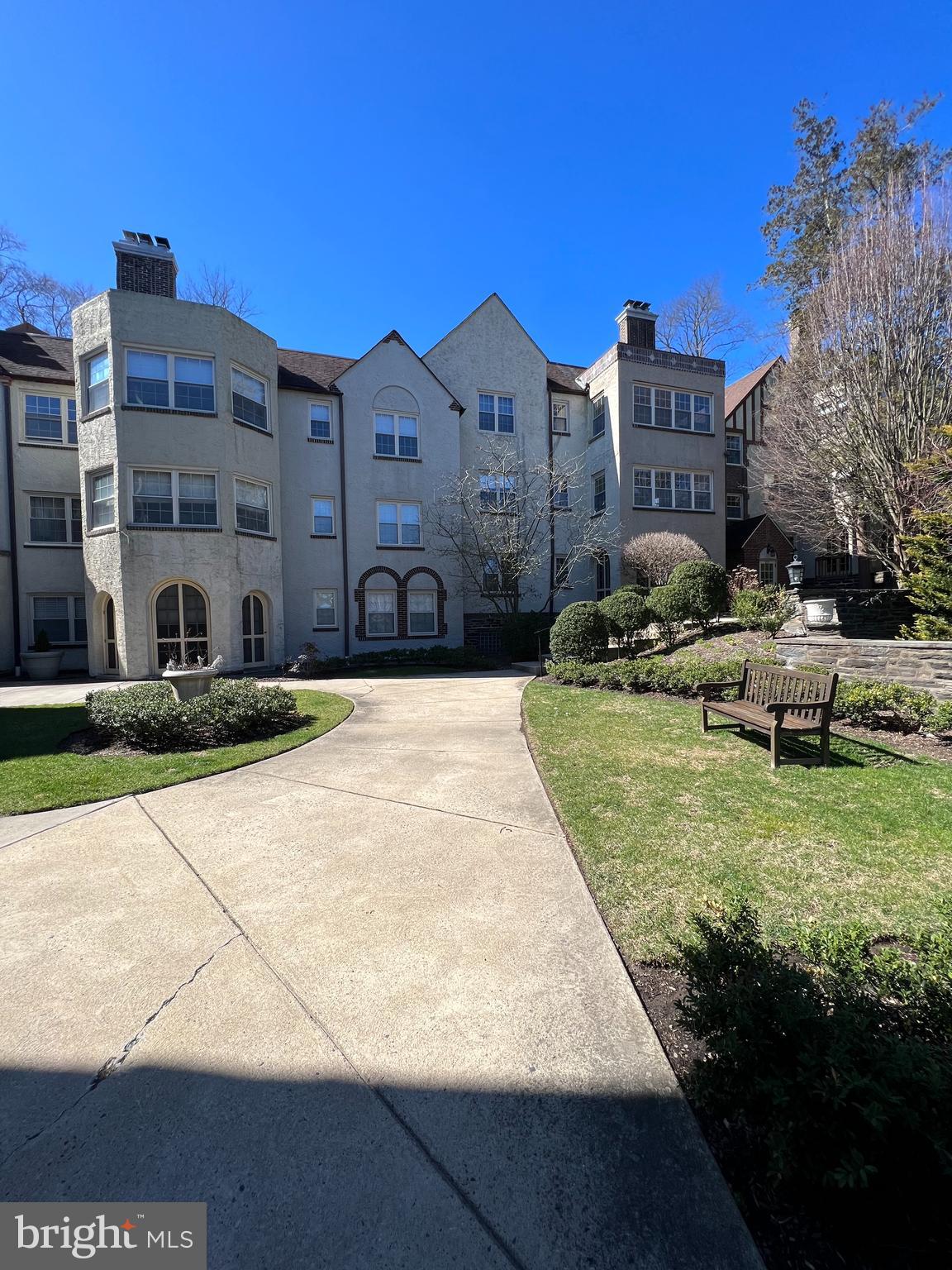 Welcome to this sophisticated and spacious 3 Bed / 1.5 Bath property. This stunning community is right across a secluded road to the Merion Regional train station.( R5), perfect for early commuting. Enter into the sprawling living room featuring a beautiful fireplace, large windows and crown molding. The living room leads to a sun filled study with built-in shelving and a gorgeous bay window. As you keep walking, you'll enter a large formal dining room. Off the dining room, you'll find the butler's pantry, galley kitchen, and private balcony with views of the surrounding grounds. Adjacent to the kitchen, you'll find the third bedroom and half bath for guests. Down the hall leads to the primary bedroom with en-suite bath and the second bedroom. This property offers almost 1600 sqft, tons of storage space, in-unit laundry, and one dedicated parking space. Please enjoy easy access to City Line Ave Shopping, Suburban Square, and Wynnewood Shopping Center. Easy commute to Saint. Joseph's University.