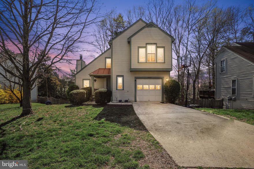 MULTIPLE OFFERS RECEIVED***The ONE You Waited to Find! Rarely Available MONTCLAIR Contemporary Single Family Home at a Townhouse Price! Sunny & Bright Updated Home has 3 Finished Levels with a WALKOUT Basement, a 1-Car Garage, a Spacious Tree-Framed Back Deck for Outdoor Entertaining with Stairs down to a Fully Fenced Backyard*Fabulous 2-Story Great Room with a Wood Burning Fireplace, Vaulted Ceiling & Skylights*Energy Efficient Windows Throughout! The Main Level has NEW Water-Resistant Wood Tile Flooring from the welcoming Front Foyer, through the Living Room & Dining Room to the Breakfast Room & Large Kitchen. The Kitchen has Newer Black Stainless Steel Top-of-the-Line Appliances & plenty of Hardwood Cabinetry for the Family Chef. The Owner's Suite boasts a Private Attached Full Bathroom & Walk-In Closet. The Top Level has 2 Additional Bedrooms, a 2nd Full Bathroom & a Convenient Upper Laundry Room with Front-Loading Washer & Dryer* The Lowest Level will be the PERFECT Space for a Game Room, Theater/Media Room, Work From Home Office, or Guest Suite. Walk-Out Level offers plenty of Natural Light,  from the Low E Windows to the Sliding Glass Door leading to the Back Patio*Extra Storage*Walk to Award-Winning Montclair Elementary*Nationally Recognized Neighborhood, featuring 3 Private BEACHES, Picnic Pavillions, Sports Fields & Basketball Courts, Playgrounds, Walking/Running Trails*GOLF, Tennis & Pool Memberships through the Private Clubhouse! Great Schools & a Wonderful Location Minutes to World Class Dining & Shopping*Express Commuter Bus Service from Montclair to DC & The Pentagon*Quick Commute to Quantico, Belvoir & the VRE Train*Welcome HOME!