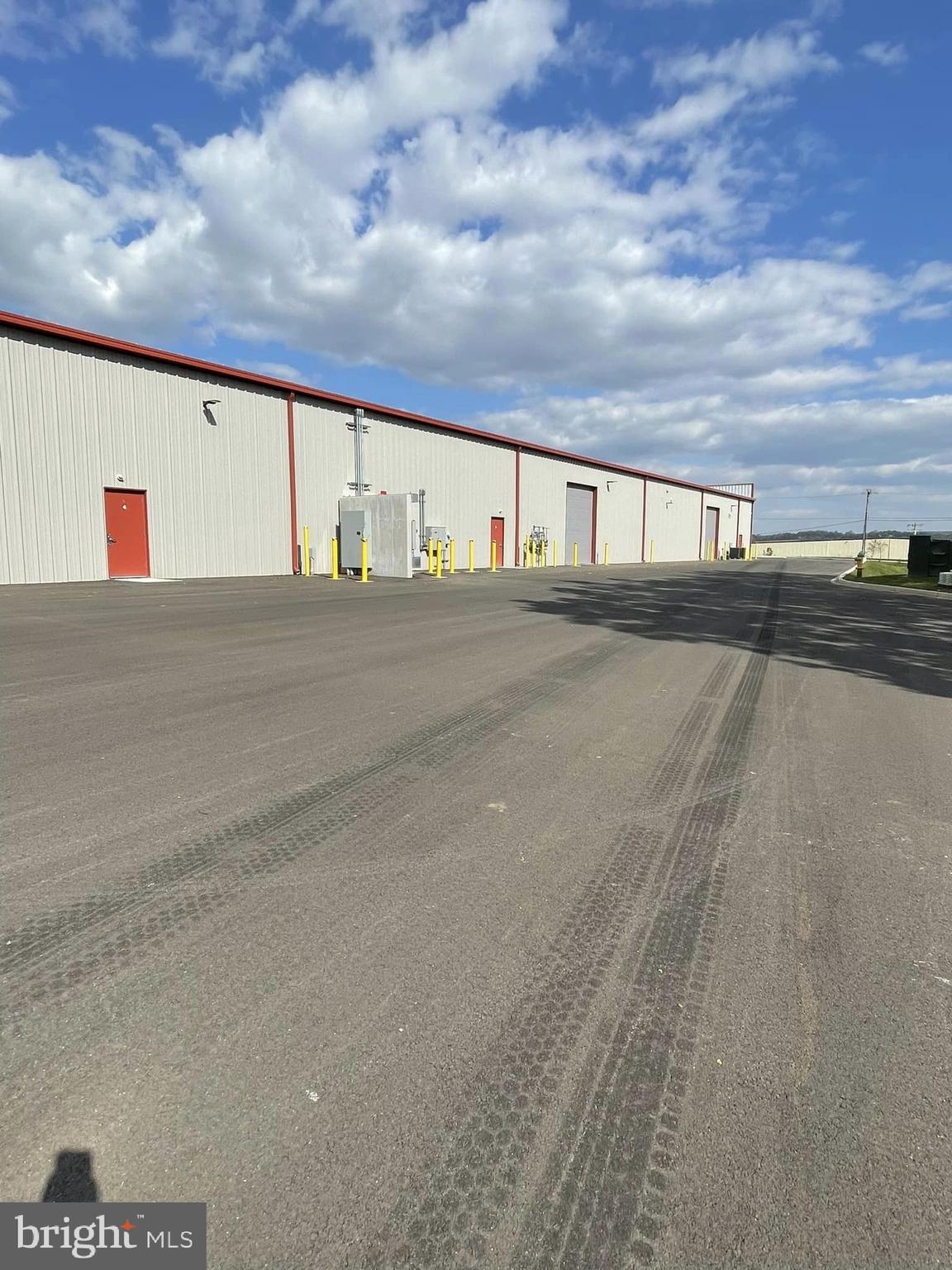 PRICE ESTIMATE for Cold Dark Shell - 331 Aviation Way is a Sprinklered Condominium Building with PRICE ESTIMATE for Cold Dark Shell - 331 Aviation Way is a Condominium Building with 55,002 SF.           Unit 3 (5,652 SF); Unit 4 (5,172 SF), Unit 5 (5,781 SF), Unit 6 (5,652 SF), are Available for Sale (Price Neg.) or Lease (at $14 SF).  
The Site totals 4.66 Acres and is Zoned M1 (Light Industrial) and located in the (AO) Airport Overlay Zone.  Located Across from Frederick Airport.