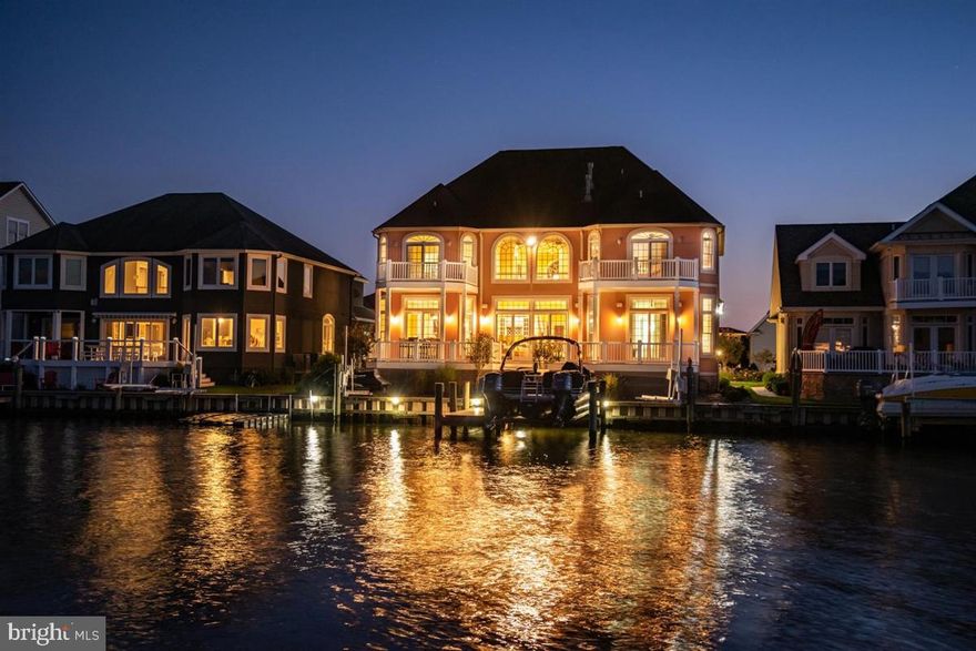 Exquisite one-of-a-kind custom 6BR/5.5BA waterfront estate in Ocean City, Maryland hits the market!  Immerse yourself in the ambience of this luxurious waterfront lifestyle while enjoying breathtaking views of the water and enchanting bird sanctuary. This property features exceptional craftsmanship with astute attention to detail. This home is built for the sophisticated buyer looking for custom finishes, efficiency and a touch of class. This home is constructed with state of the art Insulated Concrete Foam with 12 inch exterior walls and hurricane construction, including coastal grade windows and doors. This home has plenty of space for family and friends featuring five spacious bedrooms with five master suites. The  second floor sixth bedroom could be a large home office perfect for the remote worker in today's world. The first floor master bedroom overlooks the water and is fit for a king and queen with a gas fireplace and luxurious custom bath overlooking the water, and you can enjoy morning coffee on the water front deck adjoining the master bedroom. The incredible kitchen is sure to delight the chef in your family.  It features quartz countertops, two sinks, Viking appliances, upgraded cabinets, breakfast bar, eat in kitchen and many other upgrades.  The dining area is off the kitchen and overlooks the water.  The family room is off the dining room and also overlooks the water. The family room has soaring 22 foot ceilings and another gas fireplace. In total there are three gas fireplaces in this beautiful home making it the perfect place for year-round enjoyment.  There is a sunroom with a fireplace off the front of the house which could also be used as a separate dining room or second home office if you prefer.  Additional features in this waterfront estate include Brazilian cherry hardwood floors, eight separately heated tile floors with programmable thermostats, custom window treatments, two zone heating system, two zone Manabloc plumbing system with 2 Rinnai continuous hot water heaters, hardwood trim, 8 foot solid core doors, crown molding, tray ceilings, custom built-ins throughout the home, 11 foot plus ceilings, wet bar, wine cooler and ice machine.  In addition there is custom lighting, a first and second floor laundry, attic storage, central alarm system and an entertainment system. Enjoy outdoor living with the extensive maintenance free multi-level decks perfect for summer time barbecues, parties, crab feasts, entertaining and relaxing. There's a private pier with a deep water dock, 10,000 pound boat lift,  two Jetski lifts and vinyl bulkhead.  In the  front of the house there's a grand fountain creating a warm environment and the home has been professionally landscaped. This estate offers a fabulous open floor plan that maximizes spectacular views. Boasting over 4800 sq. ft., this home is in the amenity rich community of Heron Harbour.  The community amenities include an indoor heated pool, outdoor family pool, Olympic size lap pool, kiddie pool, fitness center, library, social room and two lighted clay tennis courts.  This is more than a luxurious home, it's a wonderful lifestyle.