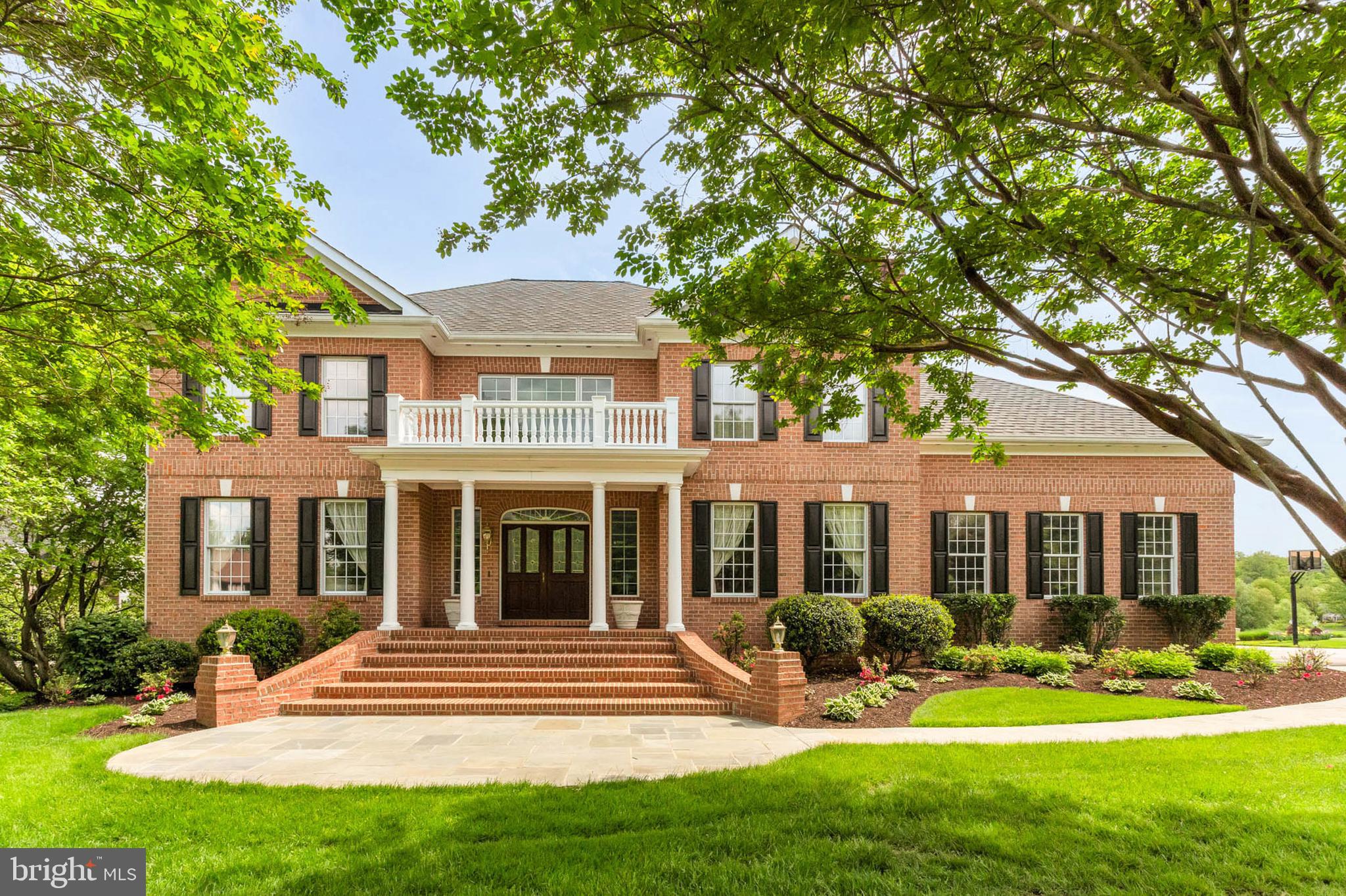 Welcome to the highly sought-after Allnutt Farms! This classic all-brick Georgian Colonial is designed with both style and function in mind, and it has been immaculately maintained inside and out. As you enter, you’ll be greeted by a grand two-story foyer that exudes warmth and elegance, flanked by formal living and dining rooms, each featuring its own gas fireplace.
On the private upper level, you'll find a spacious owner's suite and three additional bedrooms. The impressive two-story great room truly lives up to its name, boasting floor-to-ceiling custom brickwork, a cozy wood-burning fireplace, and an adjoining sunroom with a wall of windows that floods the space with natural light.
The first-floor library/office overlooks the lush backyard and conveniently has a wet bar just outside the door. The chef's eat-in kitchen is sure to impress, featuring a breakfast nook with a wall of windows, gas cooking, an island, and a pantry.
Additional highlights include a three-car side-load garage, turnkey condition, and no HOA fees. Situated on a non-through street, this home is just minutes from River Hill Shopping Center and Maple Lawn, with easy access to NSA, Fort Meade, BWI, MARC, and Amtrak. Conveniently located midway between Baltimore and Washington, this enviable location is approximately 30 minutes from Annapolis, Rockville, and D.C., and is served by one of Howard County’s most sought-after public school districts! Schooley Mill Park is just around the corner and is certainly a bonus!