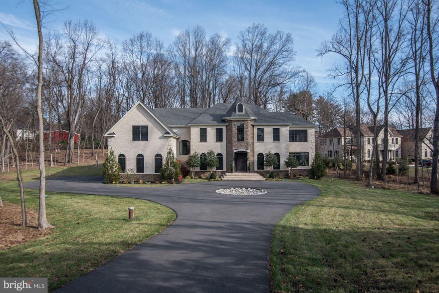 NEW HOME in the Churchill School District! Enter down a long, private drive to this fabulous home offering five bedrooms up, one on the lower level, and an option to create a large main floor bedroom out of existing sunroom that has its own full bath.  Top of the line materials used in the kitchen and baths, two gas fireplaces, media room, walk out main level to private, rear yard.