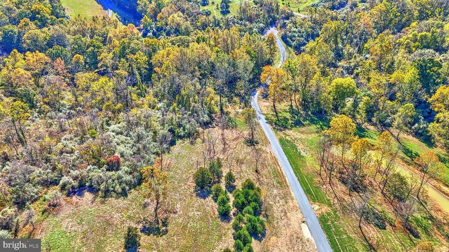 Dream Home Awaits on 45+ Private Acres in the Regency at Beacon Hill !
Discover the perfect canvas for your dream home with this stunning 45+ acre parcel, meticulously prepared and ready for construction. This remarkable property boasts a variety of terrains, including rolling hills and flat meadows.   An elevated homesite, surrounded by woods, opens to generous lawn space, fields, and a newly constructed pond. Nearly 20 acres have been expertly graded, with pruning and selective tree removal enhancing the topography and expanding views. 
A newly constructed 1,500-foot driveway leads you over a serene stream, supported by four approved arch pipe culverts, all permitted by the US Army Corps of Engineers. Additionally,  a new well was installed in 2023 and an approved septic drainfield permit for a 6-bedroom conventional system.
This property includes permit-ready house design plans prepared by Harrison Design, a renowned, estate quality residential architect.  These plans will convey with the property ensuring a seamless start to your vision.
Nature enthusiasts will appreciate the abundant wildlife, with trail cameras capturing images of turkey, bear, bobcat, deer (including piebald), fox, coyote, and even eagles. A stream naturally flows through the land, while the pond has been stocked with bass, crappie, minnows, trout, and catfish.
Explore the beauty of abundant quartz veins throughout the property, complemented by previously constructed stone walls that line the ridge. This is a perfect canvas for your dream home and outdoor adventures!
If you’re searching for a stunning property to call your own, contact your Realtor today to schedule a private tour. Exploring the land in person is a must—words and pictures can’t capture its true beauty! 

Note:  There is a tax break due to Zoning Approval in the New Catoctin South Agricultural & Forest District (AFD).  This property is in the Beacon Hill Subdivision but is NOT part of the Beacon Hill Homeowners Association.
