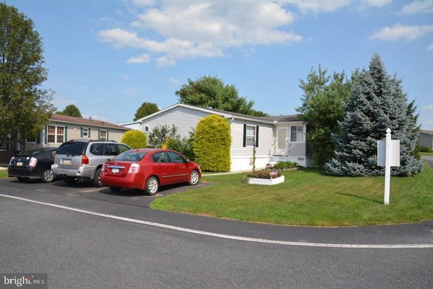 Lots of home for the money! 60 x 27, 3 or 4 bedroom & 2 bath, open floor plan, plus bonus 20 x 8 enclosed porch and huge corner lot! Very well maintained home surrounded by pines for privacy is in move-in condition! Cool central air and efficient gas heat & stove! Nice patio and shed,parking for 3 cars! Lot rent includes cable,trash, snow & mow plus use of the clubhouse. Come take a look!