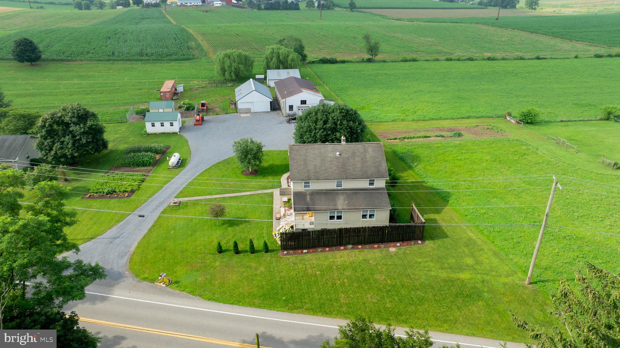 This property is going to onsite auction 9/20/2025 at 9:00 AM and is being sold with reserve. LISTED PRICE IS ONLY A SUGGESTED OPENING BID AND IS NOT INDICATIVE OF THE FINAL SALES PRICE WHICH WILL BE BY SELLER CONFIRMATION DAY OF AUCTION. Terms: Down payment of $25,000 required day of auction. Settlement on or before December 1, 2025. Transfer taxes to be paid by buyer. Real Estate taxes shall be prorated.
Beautiful property consists of 3.6+/- acres with 5 bedrooms and 2 bathrooms. New 2 car garage, 28'x56' with 2-10' overhead doors and is insulated. A 28'x56' block shop, 26'x36' animal barn and 16'x24' animal run in shed, 14'x16' storage building, 12'x20' chicken coop and the property has been well maintained. It is in excellent condition with a large yard, garden area, mature trees and has onsite well and septic.