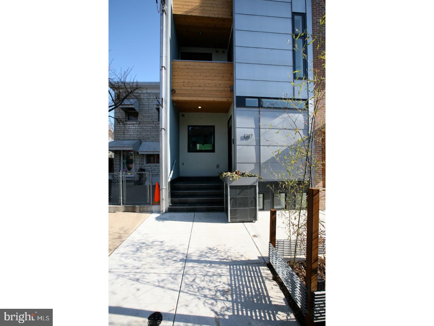 Part of the Internationally Acclaimed work of Onion Flats...the Berks/Hewson "Twins" are the First LEED-H GOLD Certified project in the City of Philadelphia!! Enter the wide open floor plan of a well designed & built home, not your typical "vanilla box" new construction. The covered "rain screen" entry protects you from the elements as you enter, collect your mail and enter the home. An over-sized planter that collects rainwater for its growth via a "rain chain" is also the disguise for your exterior secured trash & recycling center, so you never need to store/haul garbage in the home. The interior "mud room" calls you to sit on the custom bench, remove your shoes & "rack" them before entering the living space. A custom fabricated steel "waterfall wall" leads you past the floating stair, into the kitchen w/4 seat counter height bar complete w/updated contemporary finishes & appliances & a large "eyes on the street" window. The over-sized living/dining space is designed to be as flexible as you like with a nook for dining, reading, or lounging. The first floor flows perfectly to the private slate garden with custom steel planters/privacy fencing. A finished basement w nearly 9' ceilings, new plush carpet, & full bathroom provides the ideal set up for a home theatre or 4th bedroom. The Master Suite is located on the second floor w an over-sized room (& office nook), walk-in/walk-through closet & dressing room, & private deck overlooking the garden. Master Bath offers an over-sized shower w 2 shower valves/faucets, frameless glass enclosure, double vanity, mirrored backsplash, & great storage. The balance of the second floor offers another reading/office nook w entry to an exterior front deck, additionally the Washer/Dryer & HVAC units are centralized in this space. The 3rd floor features 2 more over-sized bedrooms both w large closets & private decks, a skylight bathroom w glass shower/tub enclosure & custom made double vanity, storage, & linen closet. The private vegetative green roof is also accessed from this floor and provides the most amazing, unobstructed views of Center City, from the Delaware River to the fireworks at the Art Museum. This home is so well done and priced incredibly reasonably...we are looking forward to you seeing and loving it, and soon making it your own!