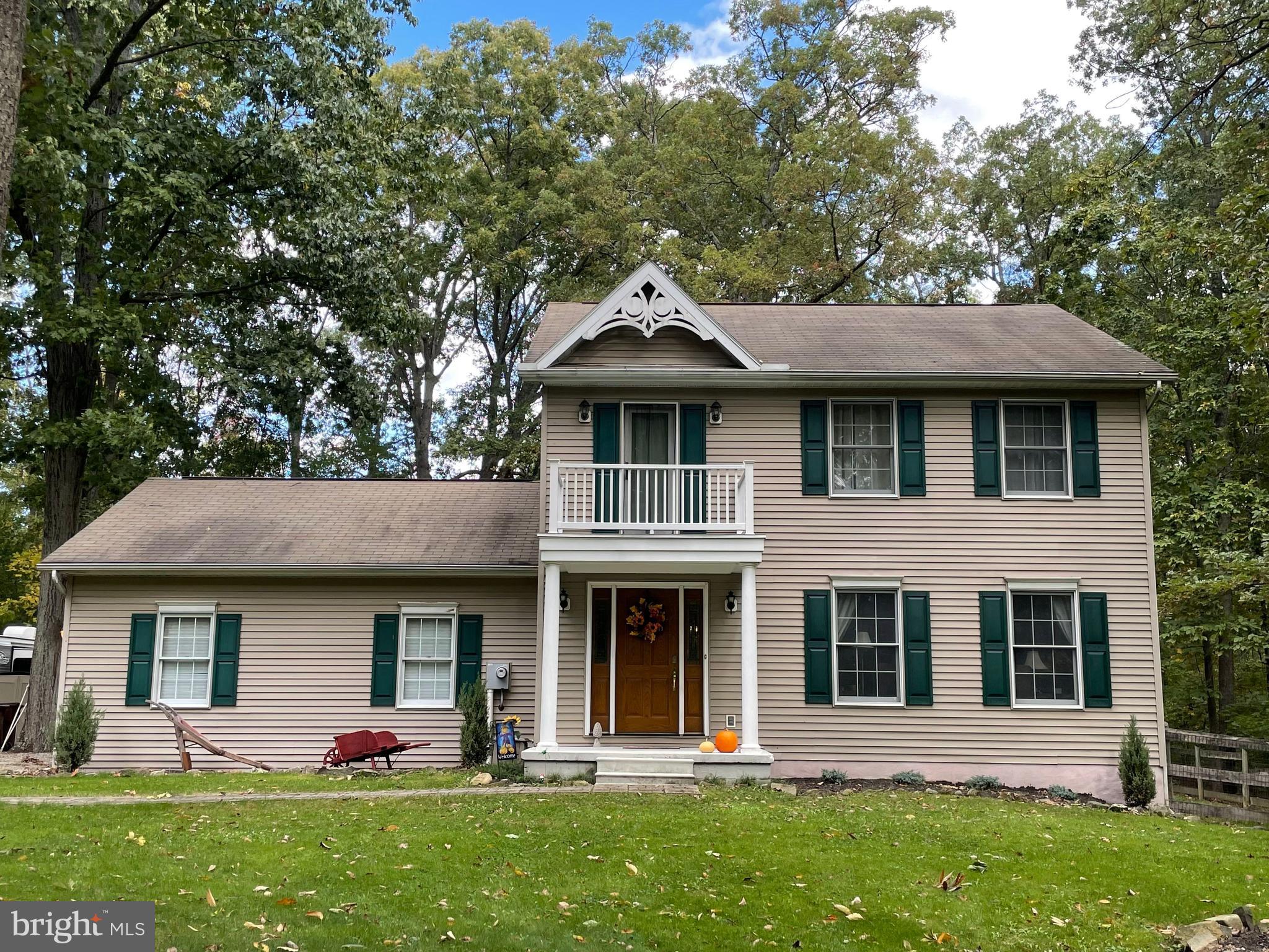 Don't miss this beautiful 3 bedroom, 2.5 bath colonial on a partially wooded, double lot! It has everything you are looking for, from stainless steel appliances, hardwood floors, a finished basement, and a private, fenced backyard. Check out the amazing, rustic style family/rec room with beautiful wood paneling, high cathedral ceilings, and a stone gas fireplace. Perfect for those chilly, winter evenings! The primary bedroom features an ensuite bathroom with a soaking tub and separate shower. The dual zone A/C is only two years old, and there is a brand new pressure tank! The lot is two separate parcels (tax id - 43025-017---000 and 43025-0106---000) being sold together for a total of 1.67 acres! All just minutes from Ski Liberty and the MD line for easy commuting. Don't miss this one!