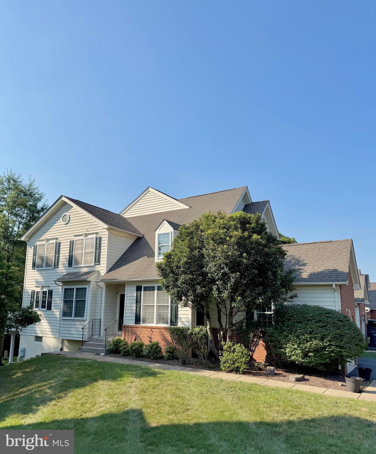 Discover this expansive end-unit townhome in a secure gated community of Dominion Valley Country Club, boasting 3 bedrooms, 2 full baths and 2 half baths, a 2-car garage, and over 3,100 square feet of living space. The gourmet kitchen features 42 " cherry cabinets, a breakfast nook, and a bump-out, opening to a generous maintenance free deck. Hardwood floors and a charming fireplace enhance the inviting living spaces. The fully finished basement includes a half bath, a built-in bar for entertaining, and access to a large outdoor patio. Ideally situated with easy access to Route 15 and I-66, this home is also perfect for commuters.