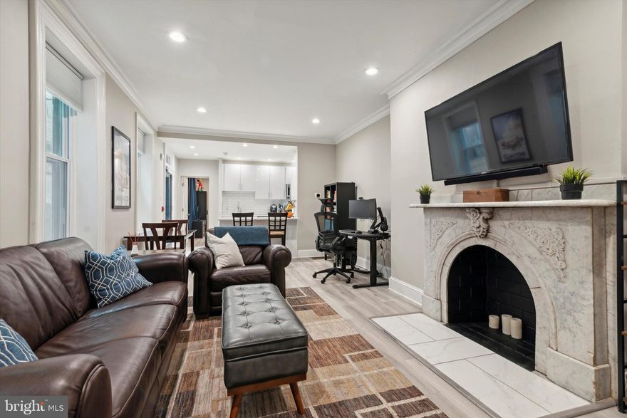 Welcome to 1512 Green St #3; a gorgeous, sunlit one bed, one bath condo with private outdoor space located on a quiet, tree lined street in Fairmount. Enter into the bright, wide-open living and dining room where you'll be greeted by a wall of East facing windows and a stunning, original marble fireplace. The open floor plan is perfect for entertaining. The kitchen features sleek white cabinetry, white stone countertops, subway tile and stainless steel appliances. The kitchen provides plenty of cabinets for storage and countertop space for meal prep and dining. A bonus living area awaits off of the kitchen. Follow the beautifully brick paved pathway that leads to a large private patio; perfect for grilling, relaxing and entertaining. The primary bedroom features a sizable closet, an East facing window and a South facing window that offers a view of the beautiful skyline. The primary bathroom is complete with a modern vanity and a spacious shower with a rain shower head and glass enclosure. The unit features hardwood floors and recessed lighting throughout, as well as a coat closet and a stacked washer and dryer that is conveniently tucked away into another closet. Special features of this unit include a Nest thermostat and a full alarm that can be used without a subscription. In addition, there is a huge storage closet (7.5' x 15')  in the shared basement.  This home is steps away from amazing museums and concert venues, Giant food store, and neighborhood favorites Osteria, Santucci's and Kelliann's Bar & Grill. It is a short walk to Center City and conveniently located to the Broad Street Line, the Ben Franklin Parkway and entrances to Rt 676 and Rt 76. Pets are welcome on a case by case basis.