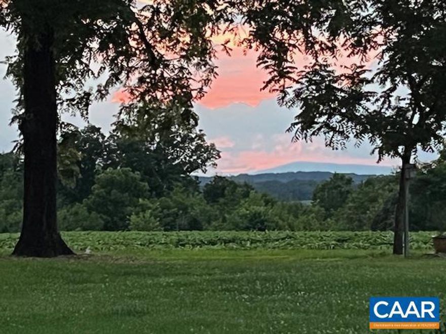 Large 310 acre farm with spectacular views and frontage on the James River, now available for new owners.  This property has been in the same family since 1758.  Two homes on the highest portion enjoy excellent views, and outdoor living has been amply provided for with patios, a fire pit, etc.  Main house includes impeccable updates and great storage.  Guest cottage has kitchenette, sitting area and large bedroom.  Other outbuildings include the original smoke house ((from around 1832), a large barn (1890's), and a detached garage, currently used to store farm implements.  Lovely fenced garden behind the main house. The acreage has portions devoted to timber, some almost ready to harvest.  Open land for agriculture is close to 80 acres.  A rare opportunity, call today to learn more about this unique opportunity.,Fireplace in Living Room