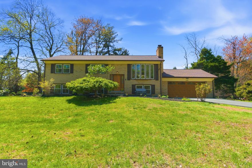 Some updates have been completed, including new windows throughout. This split-level brick home is situated in a well-established neighborhood and offers a flexible layout with five bedrooms plus an additional bonus room that could be used as an office, gym, or guest space.

The home features both an upper and lower kitchen, providing options for extended living arrangements or added convenience. Recent improvements include a new front door and rear patio door, along with a roof replacement in 2025, HVAC system in 2023, and a 50-gallon water heater installed in 2022.

Additional features include an EV charger connection in the garage, a jetted tub, and a built-in water filtration system for the kitchen sink. Outdoor spaces include a screened porch and a rear deck, and a spacious yard with a variety of mature plantings, including peach, blueberry, fig, and other seasonal growth, as well as a raised garden beds.

The bay window brings in natural light and offers a view of the surrounding greenery. Overall, the home presents a solid opportunity with several key updates already in place.