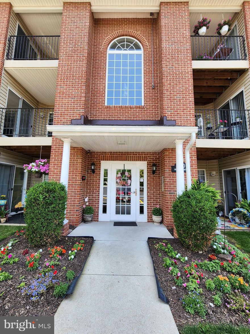 Discover this beautifully updated 2-bedroom 2 full bath condo in the sought-after community of Park Place! This home welcomes you with elegant white columns and a spacious, open layout featuring a bright family room, dining area, and a galley kitchen with new appliances, backsplash, and plenty of space for a breakfast table. Step out onto the private balcony overlooking the neighborhood, complete with a storage closet. Inside, enjoy two updated full bathrooms, separate laundry room, and two generously sized bedrooms, including a primary suite with  two walk-in closets. 1 reserved parking space, and ample additional parking. With recent updates, new appliances, elevator access to the second floor, and maintenance-free living (including water & trash), this condo is move-in ready and shows beautifully.