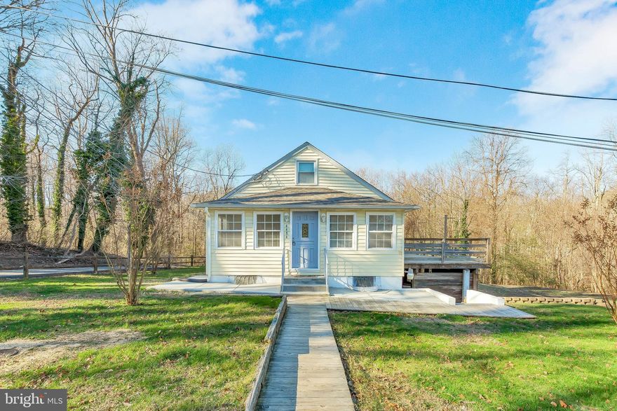 You'll love this charming, well maintained, cape cod located in Dare Beach.  Enjoy views of the Chesapeake Bay while walking the dog! New roof, New HVAC & Water Heater. Freshly painted with new carpet throughout.  Fenced yard.  Large deck overlooking 2+ acres.  Septic replaced 2012.