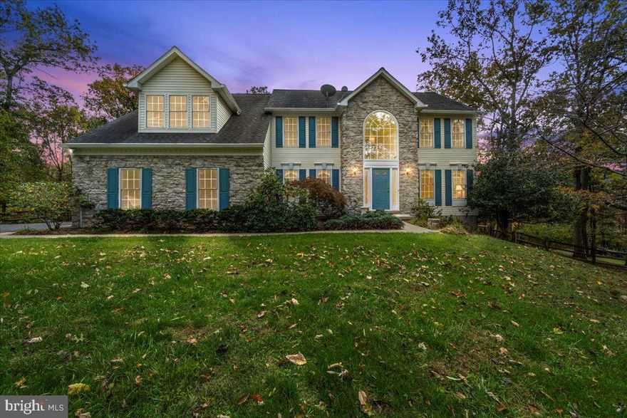 Nestled in the serene enclave of Flag Marsh Heights, this exquisite Colonial-style residence offers a harmonious blend of luxury and comfort, set against a backdrop of lush, wooded landscapes. Spanning over 5,000 square feet, this meticulously maintained home is designed for both relaxation and entertaining, making it the perfect sanctuary for those who appreciate the finer things in life. Step inside to discover a warm and inviting interior, where rich hardwood flooring flows seamlessly throughout the main living areas. The traditional floor plan features a spacious family room that effortlessly connects to the bright, clean kitchen, complete with a central island, modern appliances, and ample counter space for culinary creations. The kitchen is equipped with energy star appliances to include an electric oven/range, microwave, refrigerator and dishwasher, ensuring that every meal is a delight to prepare and share. The dining area is perfect for hosting intimate gatherings, while the breakfast nook invites leisurely mornings with views of the surrounding trees. Retreat to the luxurious primary suite, where relaxation awaits. The en-suite bathroom features a whirlpool tub, providing a spa-like experience right at home. The outdoor space is equally impressive, with a sprawling 4.19-acre lot that backs to tranquil wooded areas, offering privacy and a connection to nature. Enjoy evenings on the expansive deck, perfect for alfresco dining or simply unwinding while surrounded by the beauty of the outdoors. Additional highlights include a full basement with a walkout level, providing endless possibilities for customization, and a two-car attached garage with a convenient garage door opener. Security features such as monitored systems and motion detectors ensure peace of mind. This property is not just a home; it's a lifestyle. Experience the perfect blend of luxury, comfort, and a nature oasis in this exceptional residence, where every detail has been thoughtfully curated to create a warm and inviting atmosphere. Embrace the opportunity to make this stunning property your own and enjoy the exclusive lifestyle it offers.