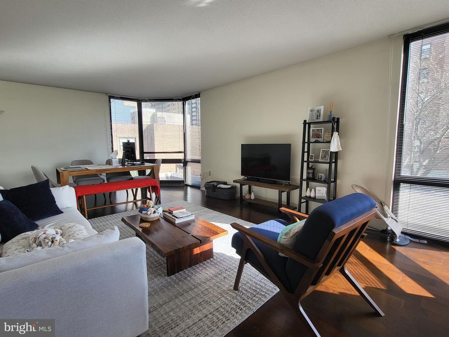 Beautifully renovated two bedroom, two bath with wonderful city views at Wanamaker House! Enter through a long foyer with excellent closet space and tile floor. The spacious living/dining room enjoys excellent natural light from floor-to-ceiling bay windows. Adjacent is the updated eat-in kitchen with wood cabinetry, stainless steel appliances, and granite countertops. The primary bedroom has excellent closet space, a large bay window and an ensuite bathroom with large vanity, shower/tub, and tile floor. The generously sized second bedroom has another bay window and ensuite bathroom with stall shower and tile floor. There is a stacked washer/dryer and vinyl floors throughout. The Wanamaker House is located one block from Rittenhouse Square and provides easy access to both Center City and University City; residents enjoy a 24-hour doorman, a seasonal rooftop pool, a fitness center, and a parking garage available for an additional fee (subject to availability). All common areas were recently renovated including the lobby, hallways, meeting room, amenity lounge, and fitness center, designed by world- renowned architect Cecil Baker.