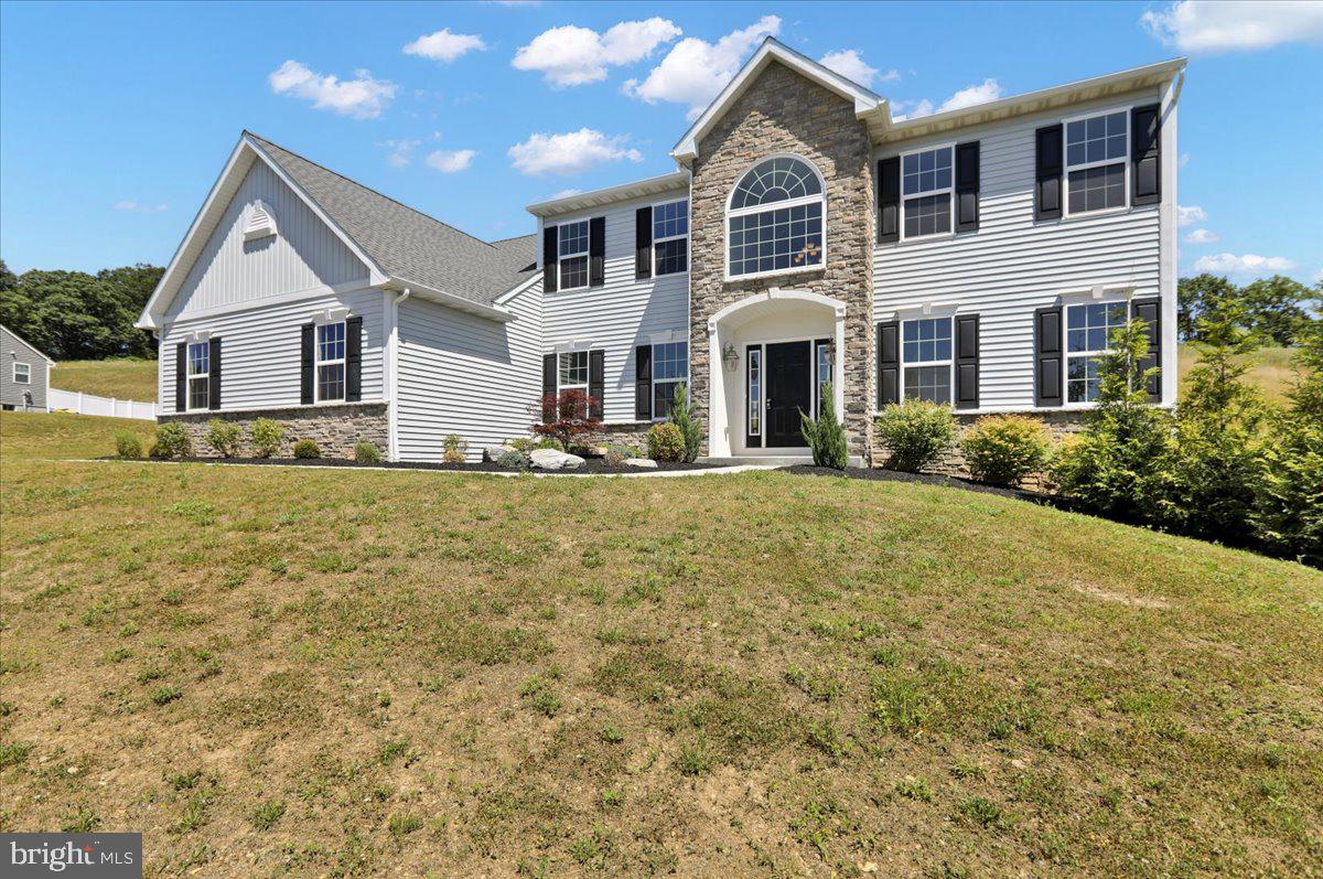 Move-In Ready! Gorgeous countryside! If you are ready to sit back and relax after a hard days work, then imagine how you will love the peace and quiet in this neighborhood. This Gisella model includes 9 foot basement and first floor ceilings, 4 bedrooms, 2.5 baths, and features many upgrades including a 3 car garage, sunroom for lots of natural light, granite countertops, custom tile shower in master bedroom, sitting room off of master bedroom, and lots more! Some photos digitally staged.