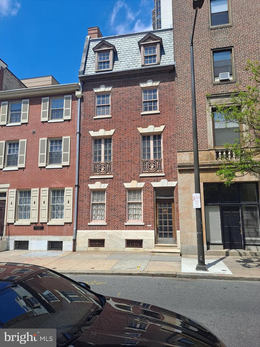 One block from RITTENHOUSE SQUARE and set on a large lot (18  x 90 ft.) between Locust  St and St James St, this beautiful house partially designed by the renowned Architect Horace Trumbauer (who also designed Philadelphia Museum of Art) is awaiting  for your touch to customize and refurbish it according to your own personal taste. The interior of the house Needs Full Renovation. Situated in the most sought-after area of Philadelphia, this building offers over 3980 sq ft of interior space, featuring 6 bedrooms and 4 bathrooms distributed over four floors,  three beautiful fire places plus a huge basement.
The back yard with exit to St James St could accommodate PARKING for two cars just by changing the access gate. Make it the residence of your dreams or transform it into four one-bedroom apartments that will bring high monthly revenue. Don't miss this rare Investment opportunity in the very center of Philadelphia!