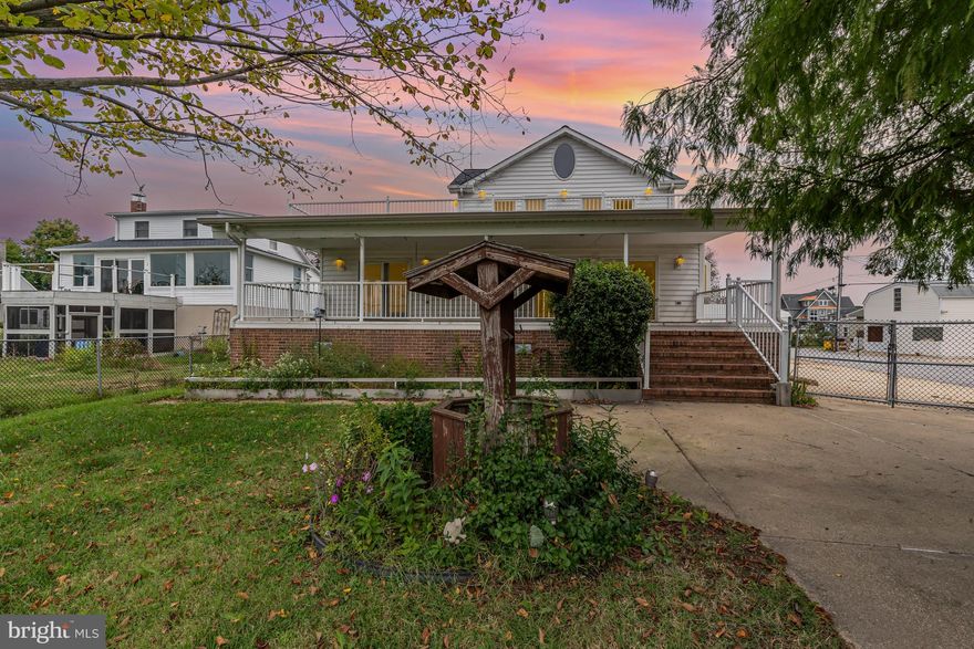 Discover one of the largest homes in the area with 2,288 sq ft above grade living space, offering endless potential to make it your own. This expansive 5 bedroom, 3 bath waterfront property boasts rare features you wont easily find elsewhere. On the main level, you'll find 2 bedrooms, 2 full baths, and a convenient laundry room, along with multiple access points to the stunning outdoor spaces. Two of the bedrooms open onto a wraparound deck through french doors, providing seamless indoor-outdoor living with breathtaking water views.  The properties waterfront amenities include a boathouse with a 150 ft electric boat lift at the end of a pier with approximately 6 to 7 ft water depth.  While the pier's electric service is currently non operational, the setup is already in place.  Car enthusiasts or hobbyists will apprecaite the detached four car garage plus a carport, offering ample storage and parking.  A fenced in yard adds privacy and security. This is your chance to secure a true waterfront lifestyle