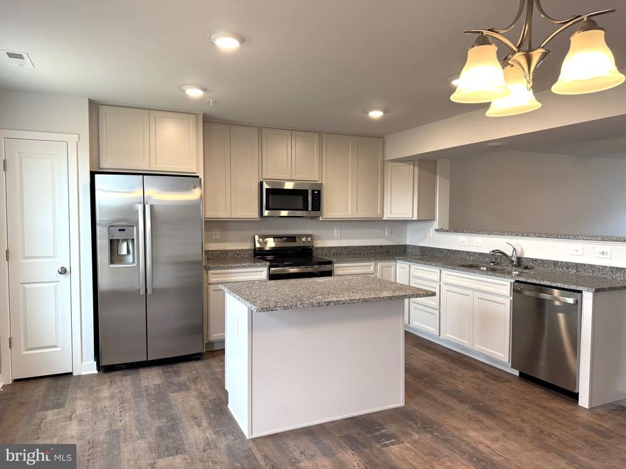 Quick deliveries, Brand New Townhomes available in The Communities of Burwell! Everything you want, already built in.  These 2-level townhomes offer 1,440 sq. ft. of thoughtfully designed living space featuring 3 bedrooms and 2.5 baths.  The open main level welcomes you with luxury vinyl plank flooring, a spacious family room with bump-out, and a beautiful kitchen complete with granite countertops, a large island, separate breakfast bar, pantry, and stainless steel appliances—perfect for everyday living or entertaining.  Upstairs, the primary suite impresses with a vaulted ceiling, walk-in closet, and spa-inspired bath featuring a tile shower with glass door and double vanity. Two additional bedrooms and a full hall bath provide plenty of space for family, guests, or a home office.  Enjoy outdoor living on your 10x12 rear deck, plus the convenience of ample overflow parking just steps away. The builder is also offering closing cost assistance!  Ideally located just minutes from I-81, shopping, grocery stores, and restaurants, The Communities of Burwell offers the perfect blend of modern comfort and everyday convenience.