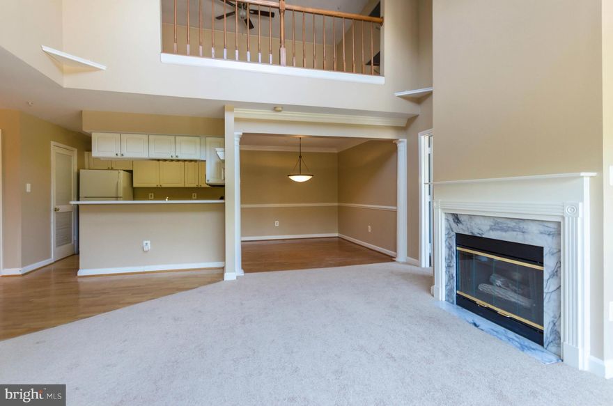 Exciting top floor condo with cathedral ceilings, second level loft overlooking living room with fireplace.  Brand new carpet and freshened paint.  Bedroom plan works well for roommates. Balcony. Washer and dryer in unit. Ready to move right in! Community features clubhouse, swimming pool, BBQ area, with plenty of parking.