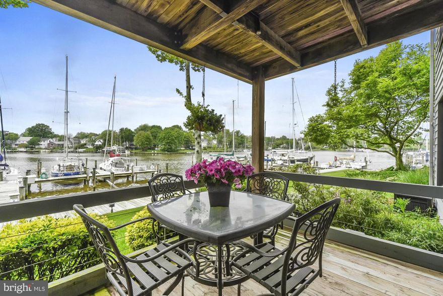 $810,000 total selling package - 60 Ft. slip sold separately $50,000 YACHTMANS' DREAM!  1800 SF  terrace condo | Walls of glass | Waterfront deck across entire condo...plus brick patio w/koi pond and and bonsai garden. Living room w/wood burning FP | Kitchen w/breakfast area | Dining room, built-ins | Lush master suite | CUSTOM BUILTIN'S | 2 deep water slips - 60' and 30' slip w/floating dock