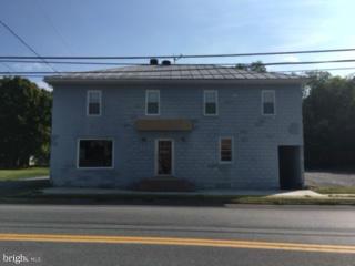 Unique investment property with great space for office or retail use. Ground level space is 1600 sq. ft. with 2 bathrooms, 2 changing rooms, reception counter, and 2 entrances. Basement has finished storage space and area for a separate office. 3rd floor level is currently rented as an apartment with separate entrance.