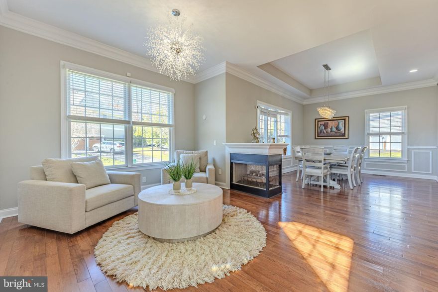 This move in ready luxurious corner lot smart home with energy efficient upgrades in the prestigious gated neighborhood of Lake Manassas Community offers a perfect blend of elegance and convenience. Seller Incentives: Includes a 1-year home warranty (up to $1,000 of your choice), a VA-assumable 2.875% loan through Veterans United, and seller concessions to assist with closing costs. Gourmet kitchen equipped with black stainless steel appliances, modern cabinetry, and sleek quartz countertops — a chef's dream for both cooking and entertaining.

Engineered hardwood floors flow on the main and upper levels with remote controlled ceiling fans throughout, adding sophistication, while the stylish rectangular plank tile in the basement adds a modern touch.

The master bathroom is a true retreat, complete with a jetted tub, separate spa shower, glass front electric double -sided fireplace with cooling/heating/lighting options, upgraded vanity, and high-end designer tile. The expansive walk-in closet off the master bathroom ensures plenty of storage space with custom built in shelving . The upper-level laundry adds convenience, while the spacious walkout basement with rough in for a wet bar is perfect for hosting gatherings.

New HVAC units ensure year-round comfort, and the large deck with stairs leading to the backyard and patio is perfect for outdoor living. This home also offers easy access to all the fantastic community amenities to include the following: 5 mile trail loop,  scenic Lake Manassas, Robert Trent Jones Golf Club (Private), Stonewall Golf Club (Public), community pool, tennis courts, pickle ball courts, basketball court, and common club house.  

With easy access to major transportation routes such as I-66, Route 29, Route 15, Washington St, and Linton Hall Rd, this location is ideal for commuters. In addition, you're just a short drive from Virginia Gateway, Haymarket Super Center, The Shops at Stonewall, a wide range of shopping, dining, entertainment options, and retailers such as Wegmans, Target, Lowe's and more. This smart home truly combines lavish living with unmatched convenience.