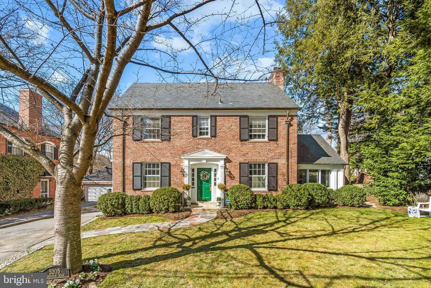 This classically elegant, updated brick Colonial on a quiet street in coveted Westmoreland Hills features a freshly renovated eat-in kitchen, main-level powder room, five bedrooms on the upper two levels, a lower level playroom, and a sunny flat yard. The bright main level, with hardwood floors throughout, has a gracious entry foyer and adjoining living room and family rooms that both overlook the charming rear patio and flat yard.  The large dining room with a beautiful Bay window leads to the thoughtfully renovated kitchen, which also walks out to the rear yard.  The Second Level has three bedrooms and two bathrooms, including the Primary Suite that has three bright windows, built-in closet space, and a renovated bathroom. The Third Level has two additional bedrooms and one updated bathroom, all overlooking the beautiful rear yard. The Lower Level includes a large, finished recreation room, an additional half bathroom and a laundry room. Also included is a long Driveway that can easily accommodate tandem parking for two cars and a detached Garage structure, currently used for storage. Ideally located just a few blocks to Westmoreland Hills Park and in close proximity to the Capital Crescent Trail, the Shops at Spring Valley and several popular commuter routes.