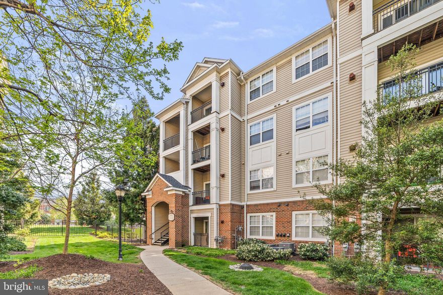 A beautiful first-floor condo in excellent condition with two assigned garage parking spaces.  Spacious living/dining area with tons of natural light. Features a kitchen with an island, stainless steel appliances, backsplash, and a built-in bar area. The spacious master bedroom offers a walk-in closet and large full bath. Laundry room in-unit and a private patio with extra storage space. This gated community offers a clubhouse with evening and weekend concierge service, 24-hour security, 2 community pools, a gym open 24/7, a billiard room, a business center, an outdoor grilling area, and more. Grocery stores, shopping, and restaurants are within walking distance and the new Herndon metro station will be right down the road. Welcome home!