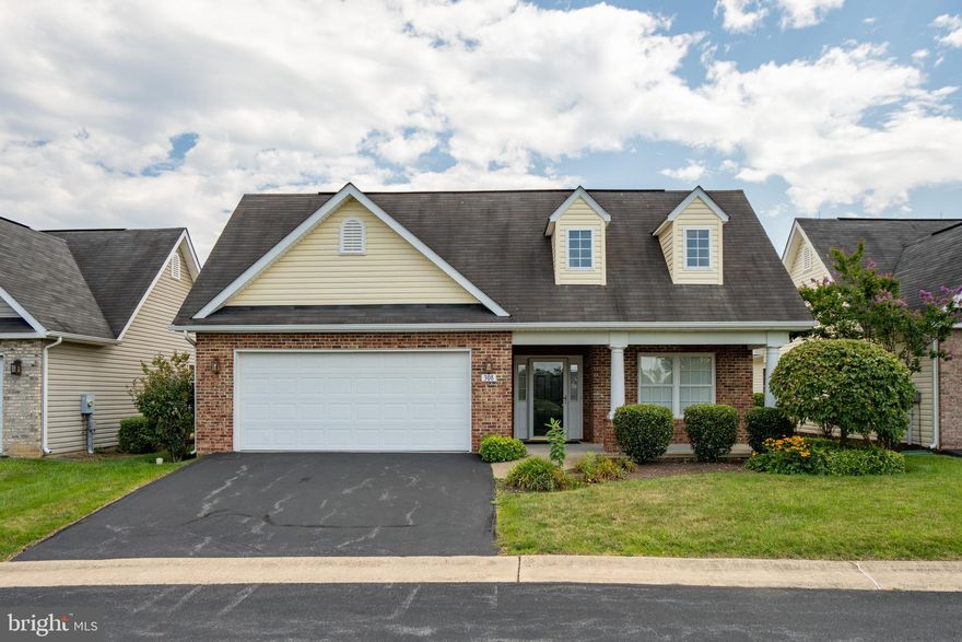 You'll find this well maintained home in the sought after55+  Cross Creek Village ready to move in.  The larger of the offered floor plans, it has 2 bedrooms and 2 full baths plus a bonus room.  From the moment you walk from the broad front porch into the foyer you feel the spaciousness of the open floor plan with 10 foot ceilings.  The Guest bedroom with hall bath tuck away on one side while the main floor laundry, storage and garage access flank the other.  From here a wide hall takes you to the heart of the home starting with the dinning room.  As you enter this part of the home the kitchen and breakfast nook tie seamlessly to the dinning and living room for exceptional entertaining. Opposite the Primary suit has generous floor and closet space as well as two vanities and walk in shower. This home also offers a bonus room with walk out patio doors that would make a beautiful office, craft room or extra sitting room. The community HOA takes care of the hard work of snow removal, trash and yard maintenance while you get to enjoy the club house and more time with friends and family.