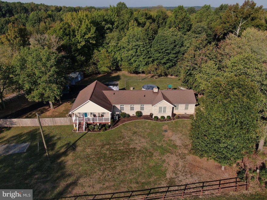 So much to love! This spacious raised rambler with main level living and an open floor plan, rests on 3 lovely acres. A large family room on the lower level adds additional living space to the already ample main floor footprint. Walking down the hall from the main living area with attractive flooring and vaulted ceilings are two large bedrooms and a hall bath, in addition to the master bedroom and beautifully tiled master bath. The laundry room is also conveniently located on the main level. Stepping out onto the generous sized deck, the backyard hosts an above ground pool and play area while the property stretches back to several private wooded acres. There is also a shed and 2 vehicle carport. Commute easily to the Rt. 17 Commuter lot and I-95.  Shopping and dining are minutes away.   Don't miss this one.  AMERICAN HOME SHIELD WARRANTY. NEW SURVEY AVAILABLE