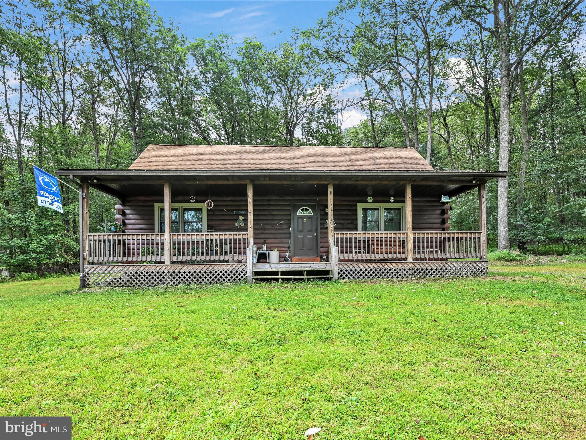 Welcome home to this custom 2001 log home in the Blue Mountain School District. This home features three bedrooms, 2.5 baths, an eat-in kitchen, and a private upstairs primary with a full bath. The main level features a spacious living room that opens to the kitchen with dining area, as well as two bedrooms, a laundry room, and a full bath. A full-size covered front porch and a back deck for outside enjoyment. Original owner with pride in ownership. Call today to schedule a private showing.