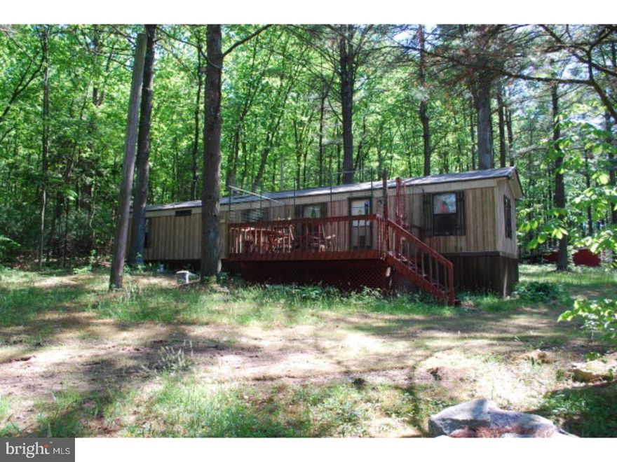 Perfect Secluded Getaway.  Just under 31 Acres of Privacy!  Currently, the property has a 2 Bedroom Mobile Home with a large deck, Multiple Garages for outdoor activity gear, a Hunting Cabin complete with electric, water, wood stove, cable and phone.  Enjoy the outdoors with the stone grill, deer trails through the trees, and small pond.  Or build your dream home!  The septic is designed for a three bedroom home to be added. Mailing Address Continued: New Ringgold