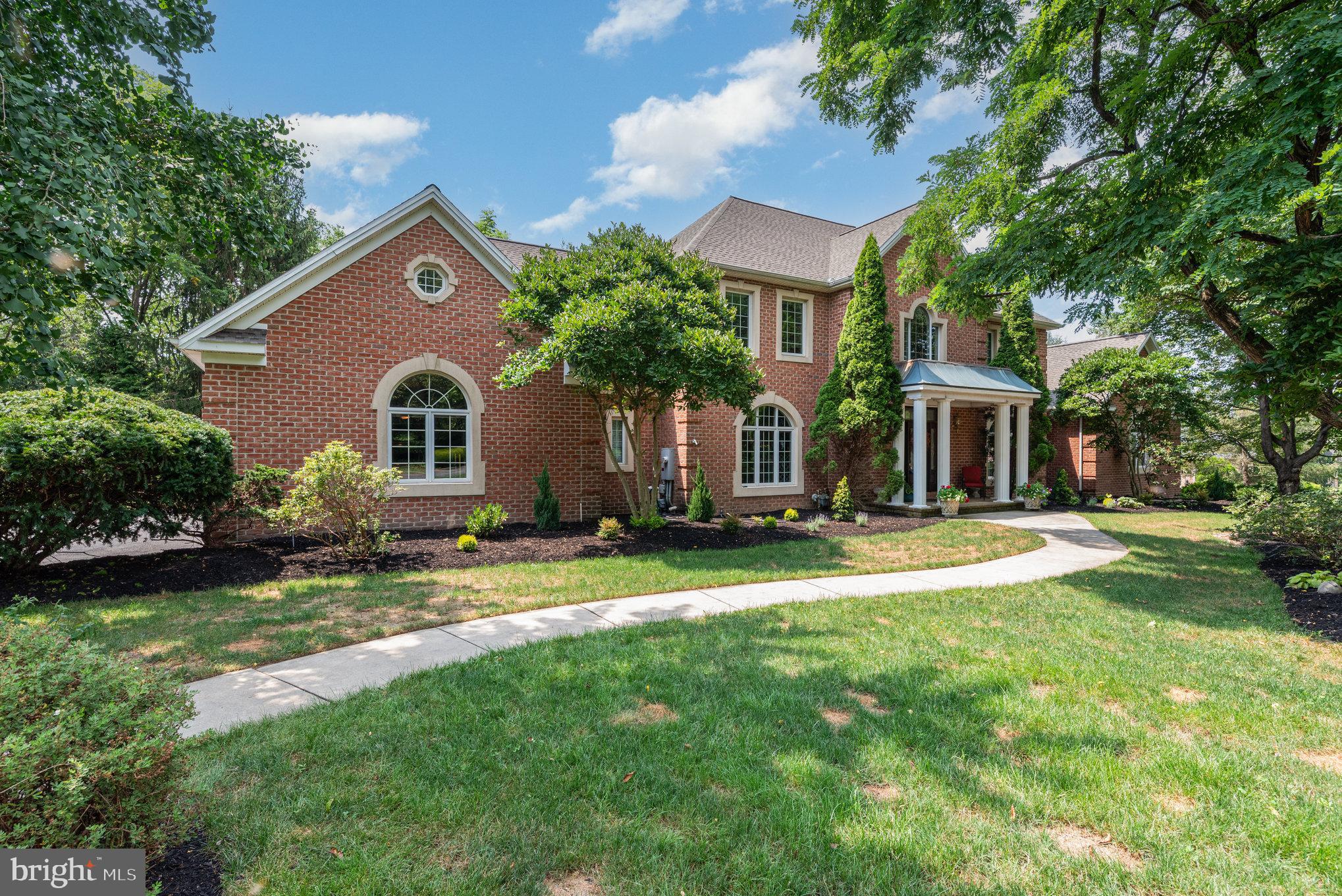 It begins with a quiet drive down a tree-lined road in the prestigious Pinehurst community. You round a gentle curve, and there it is—your sanctuary. Nestled on nearly two acres of untouched, wooded beauty, this all-brick estate stands with quiet confidence, waiting to welcome your new home.
Crafted by the master builder Harry Claypool, Jr., every brick and beam of this 7,000+ square foot residence tells a story of craftsmanship, intention, and luxury living rooted in nature.
Step through the front door and into a grand two-story foyer where a sweeping circular staircase invites you upward, and the subtle hush of the forest outside begins to calm your senses. The vaulted family room takes your breath away with its floor-to-ceiling stone fireplace and a wall of glass that opens to views of the trees and a gentle stream meandering beyond. Here, nature isn’t just a backdrop—it’s part of the experience.
This is a home designed for those who crave both sophistication and stillness. You’ll find formal living and dining rooms perfect for entertaining, and a richly paneled office complete with a coffered ceiling and fireplace—ideal for deep thinking or quiet reading as deer pass quietly by your window.
In the heart of the home, the gourmet kitchen hums with possibility. Granite countertops, a generous center island, top-of-the-line appliances—it’s a space where meals are made, stories are shared, and laughter lingers long after dessert. The open flow keeps you connected to family and guests while sunlight pours through oversized windows.
And when the day winds down, there’s no better place to unwind than in the hot tub nestled on your private deck, it’s your personal spa under the stars. Whether it's a crisp autumn evening or a quiet summer night, the warm water, fresh air, and total seclusion create a moment of pure bliss. Here, the outside world fades, and all that’s left is peace. When you are done, your first-floor primary suite awaits. It’s more than a bedroom—it’s a private retreat. Wake up refreshed and sip your morning coffee from a secluded balcony while the birds sing and the woods whisper around you. The towering trees provide year-round privacy, serenity, and shade.
Upstairs, four additional bedrooms each offer their own ensuite bath and walk-in closet, ensuring every guest and family member has a quiet space to call their own. Downstairs, the finished walk-out lower level opens up a new world of possibilities. Host game nights around the double-sided fireplace, unwind in your exercise room, or create a second kitchen—already plumbed and ready for multi-generational living or effortless entertaining.
This home has been lovingly updated with thoughtful attention to detail: a new roof, skylights, and flashing in 2024; a beautifully refurbished multi-tiered deck in 2025; and countless touches that speak to pride of ownership—20 illuminated closets, dual staircases, and architectural finishes that elevate every space.
Step outside, and the magic continues. Your backyard isn’t just a yard—it’s a private nature preserve. Wildlife roams freely. There is a 35’ bridge that crosses Sears Run and leads to an additional acre with walking paths. Or simply sit at the edge of the creek and enjoy the water as it sings and flows over the dam. If you have children or dogs, they love to play in this oasis.
With a four-car garage, zoned HVAC, central vacuum, and state-of-the-art security, every modern comfort is at your fingertips—without ever disturbing the peace.
This isn’t just a home. It’s a story waiting to be lived. A place where luxury and nature embrace. Where memories are made and peace is found. Come walk the woods. Feel the quiet. And discover what it means to truly come home.