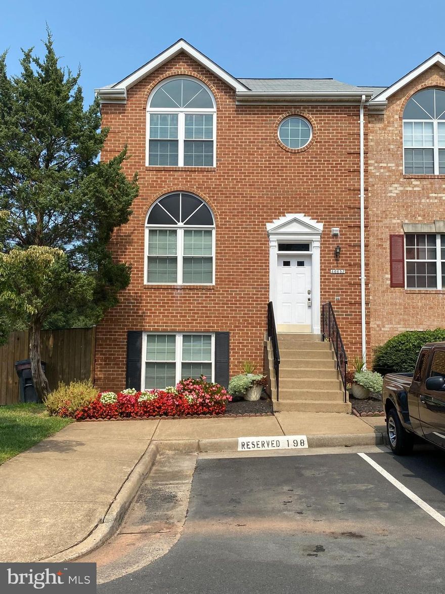 Beautiful end unit, all brick town home. 4 bedrooms, 3.5 bathrooms. Large kitchen with fireplace. Stainless steel appliances, granite counter tops and new cabinetry. Hardwoods throughout on main level. Finished basement w/ full bath and rec room. Walkout to the fenced backyard for privacy. Terrific location, quick drive to restaurants, groceries, regional library, Northern Virginia Community College just steps way.