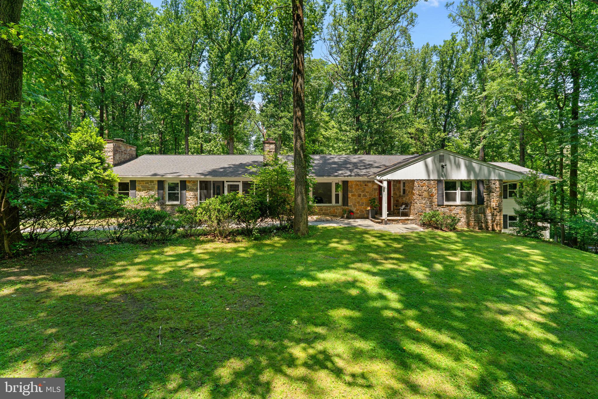 You’ll have more fun living here! This unforgettable Glenwood rambler sprawls over 3,500 square feet on the main level, sits on a private 1.7+ acre lot, and features over $370K in upgrades! The shaded front walkway leads to a welcoming entry where you’re greeted by a sunny living room with a picture window and cozy stone fireplace. The open-concept dining area features recessed lighting and a statement chandelier, flowing directly into the show-stopping kitchen. With luxury vinyl plank floors, stainless steel appliances, display cabinetry, cooktop, and built-in microwave, cooking and entertaining are effortless and stylish.
Need a place to focus? A dedicated office offers built-in shelving, updated flooring, and its own fireplace. Prefer to unwind? Head to the spacious family room where a floor-to-ceiling stacked stone fireplace sets the stage for movie nights or game nights. Looking for something more invigorating? Just wait until you see the swim spa room, a 2019 addition with walls of windows and space to stretch, splash, and recharge. A renovated half bath with a bold accent wall, a large laundry room, and a screened front porch for bug-free lounging round out this wing of the home.
Down the hall are three generously sized bedrooms with updated ceiling fans and ample closet space. One offers direct access to a beautifully remodeled full bath with upgraded tub surround and sleek fixtures, while the other two share a second stylish full bath with custom tilework and a double vanity. At the end of the home, the massive primary suite is your personal retreat with a wood stove, walk-in closet, accent wall, and private balcony for peaceful mornings. The spa-like ensuite features a freestanding soaking tub with waterfall faucet, dual vanities, a walk-in shower with dual shower heads, and a picture window overlooking the serene backyard. For even more space and privacy, a staircase leads to a lower-level bonus room, ideal for a home gym, office, or creative studio.
The finished lower level offers flexibility for guests, hobbies, or extended living, featuring a rec room, a bedroom with an egress window and a generous closet, a full bath, and a second expansive bonus room currently set up as a gym.
Step outside and let the fun continue! With room to roam on 1.7+ acres, there’s space for pups, yard games, and summer celebrations. The back deck connects directly to the swim spa and kitchen for easy entertaining, and the lower patio offers the perfect spot for your grill, smoker, and outdoor dining setup. Welcome home!